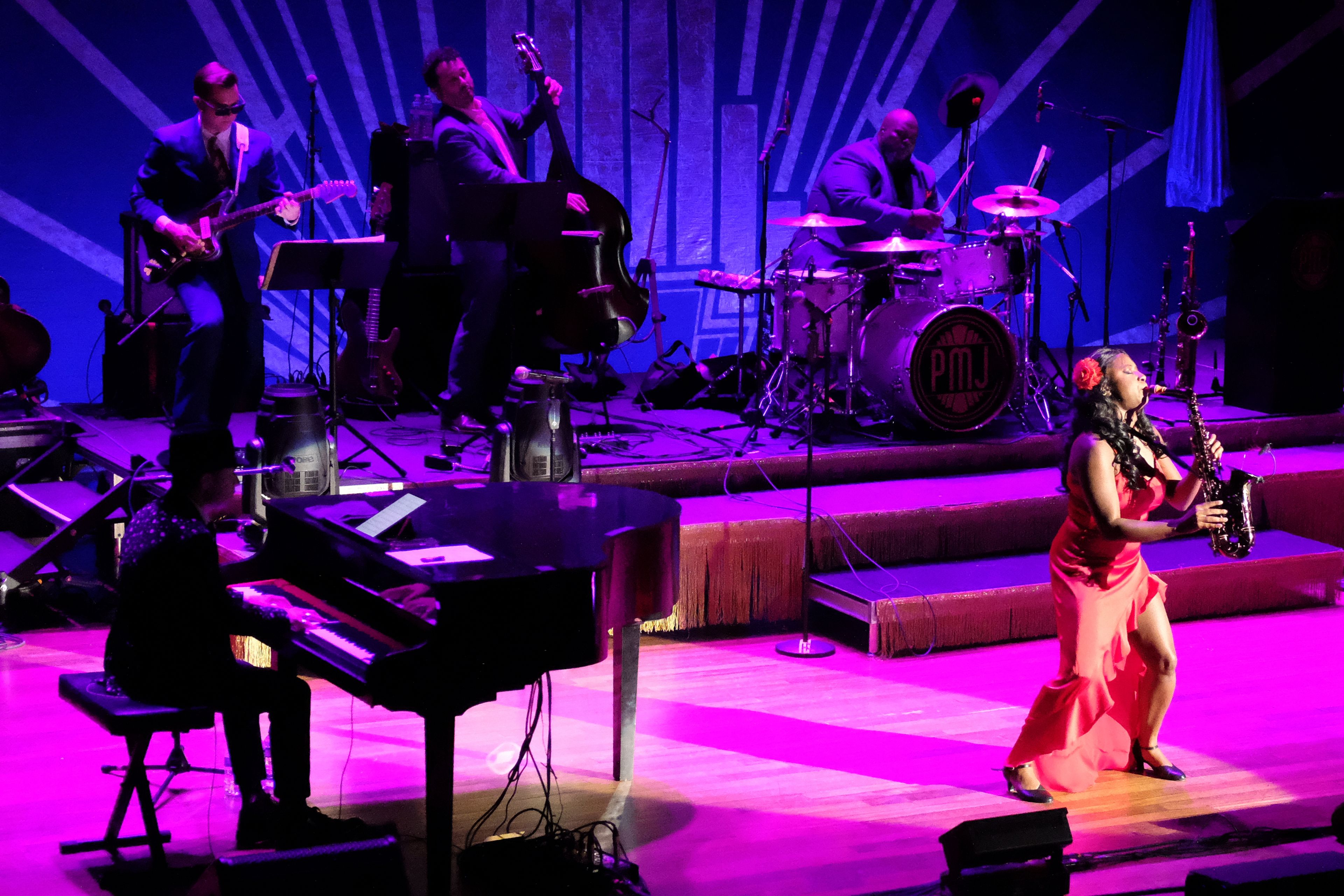 Members of the band Postmodern Jukebox perform on stage at the Ryman Auditorium during a concert in Nashville, Tenn., on July 30, 2024.