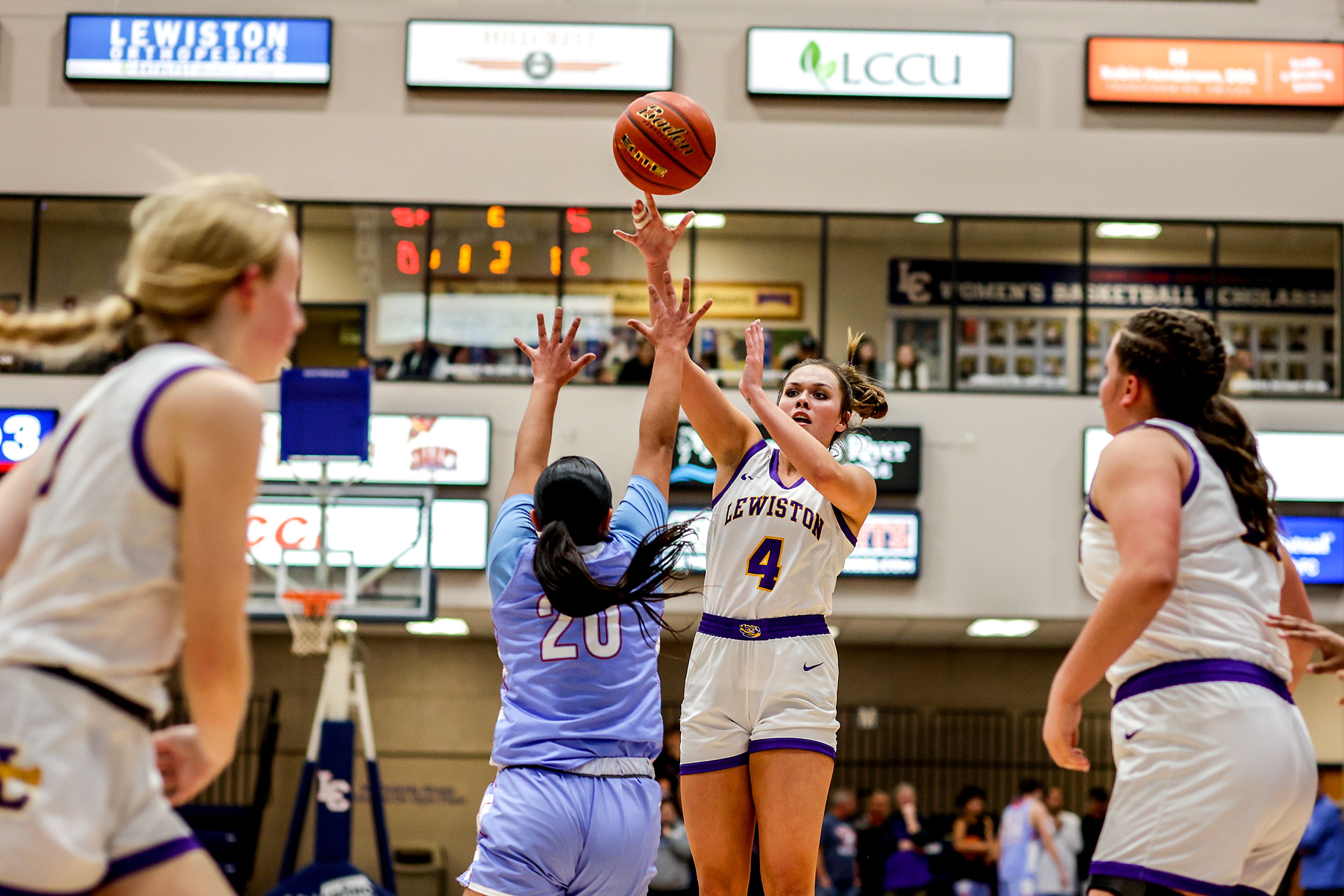 Lewiston post Reese DeGroot shoots the ball as Lapwai shooting guard Lauren Gould defends during the Avista Holiday Tournament on Wednesday.