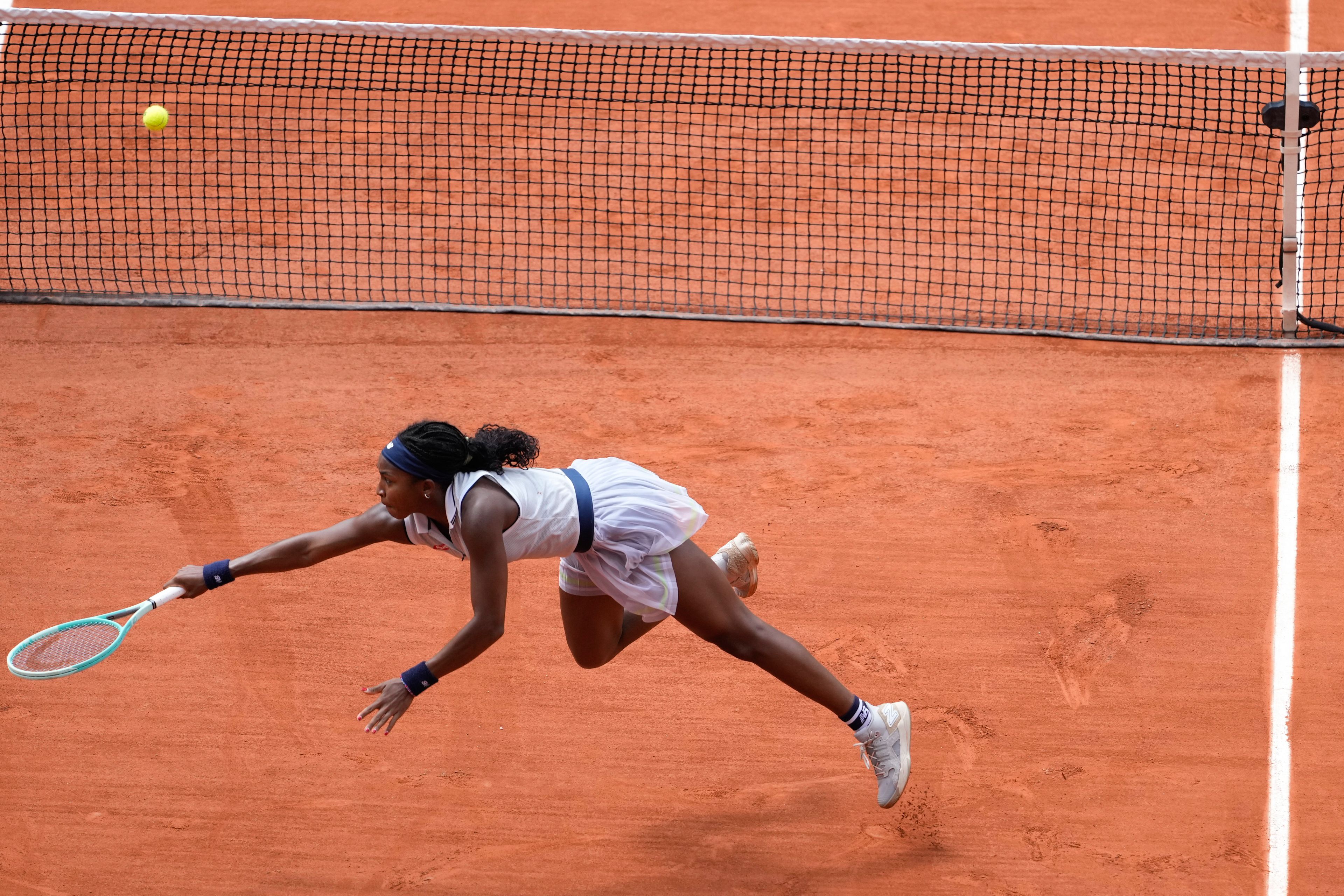 Coco Gauff of the U.S. plays a shot against Tunisia's Ons Jabeur during their quarterfinal match of the French Open tennis tournament at the Roland Garros stadium in Paris, Tuesday, June 4, 2024.