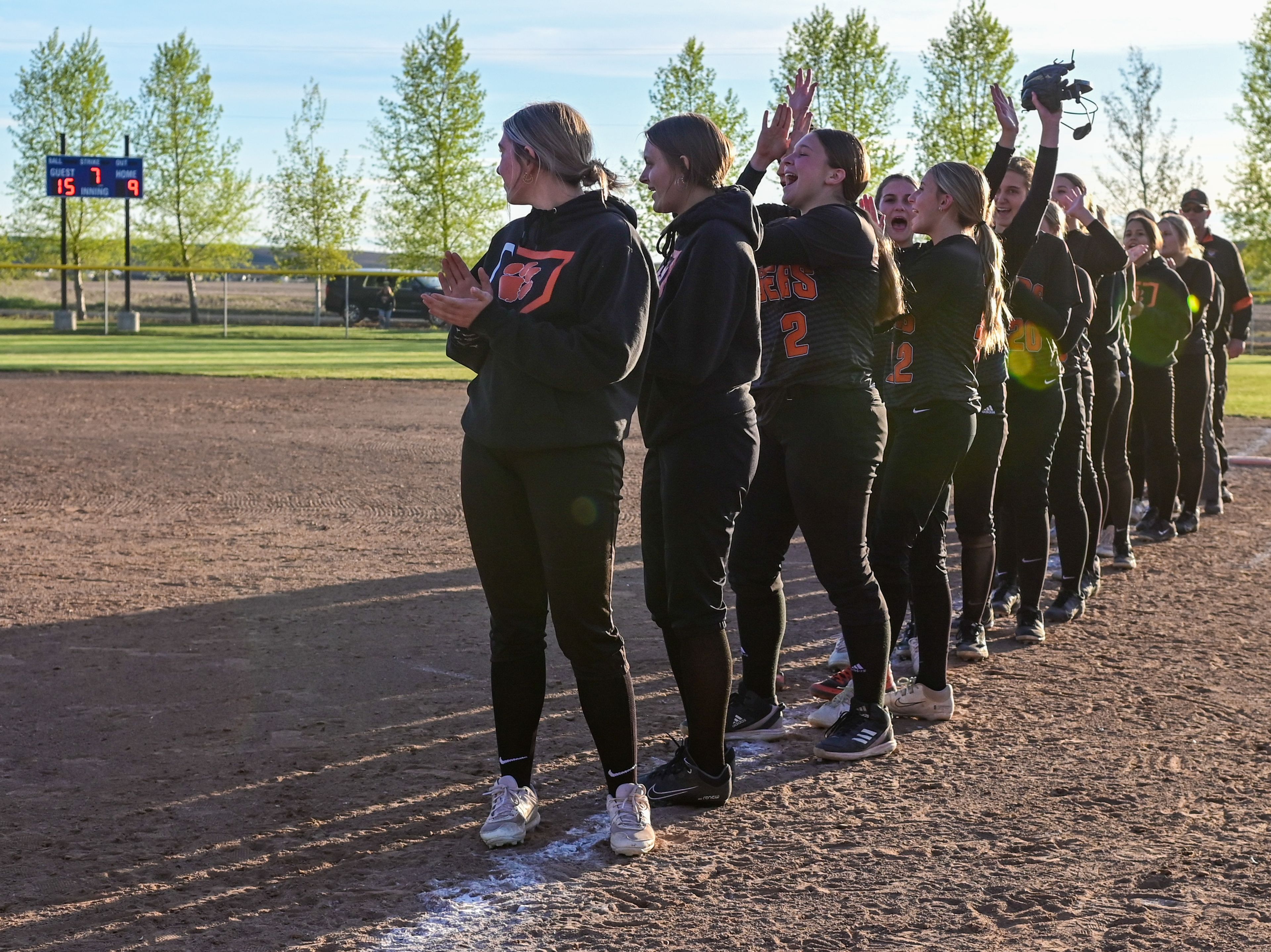 Kendrick players cheer as they are announced as Idaho 2A district champions after their win over Genesee on Wednesday in Genesee.