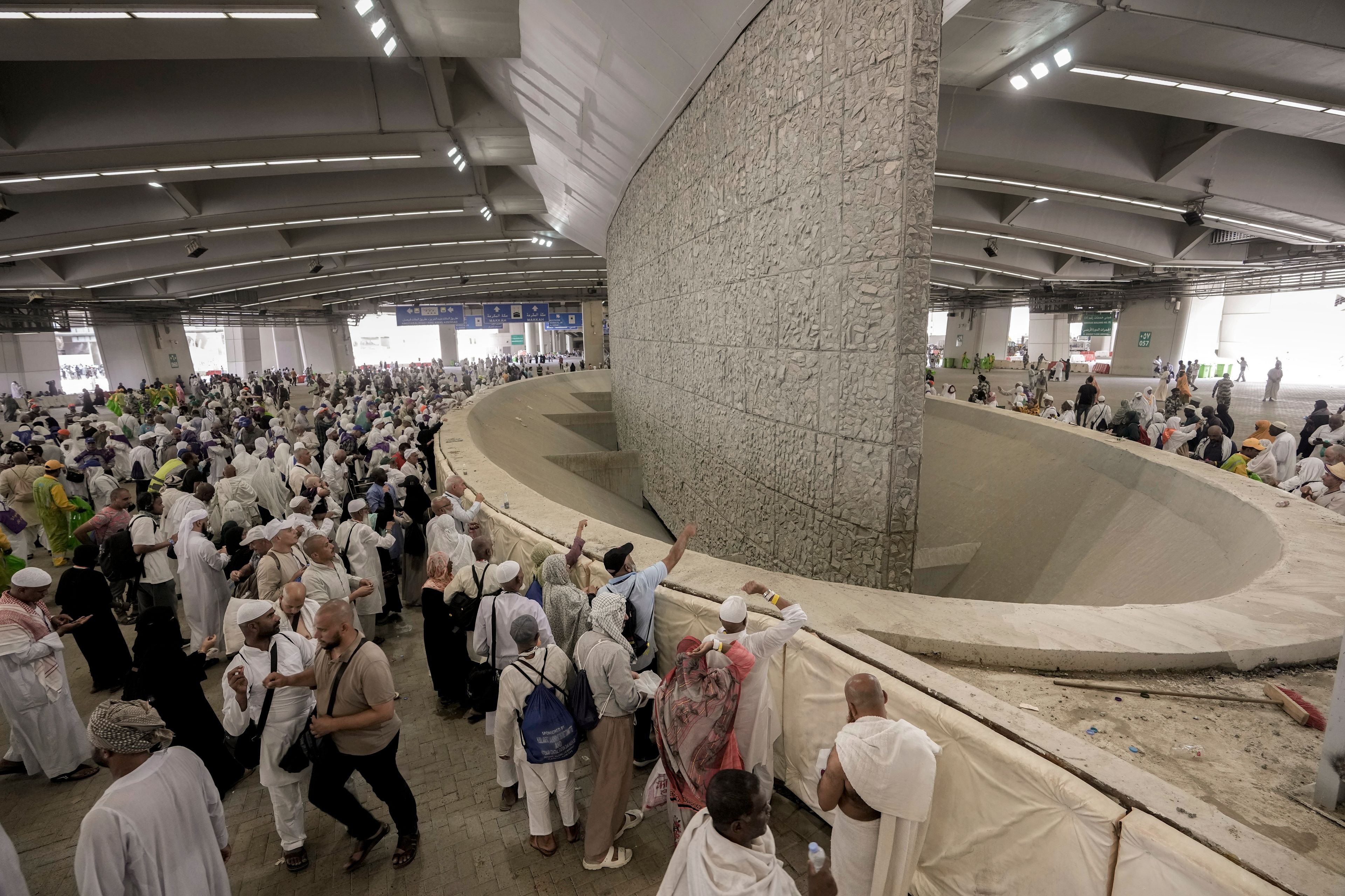 FILE - Pilgrims cast stones at a pillar in the symbolic stoning of the devil during the annual Hajj pilgrimage, in Mina near the holy city of Mecca, Saudi Arabia, on June 29, 2023. Once a year, Muslim pilgrims coming to Saudi Arabia from around the world unite in a series of religious rituals and acts of worship as they perform Hajj, one of the pillars of Islam. Among other rituals, pilgrims throw pebbles in a symbolic stoning of the devil.