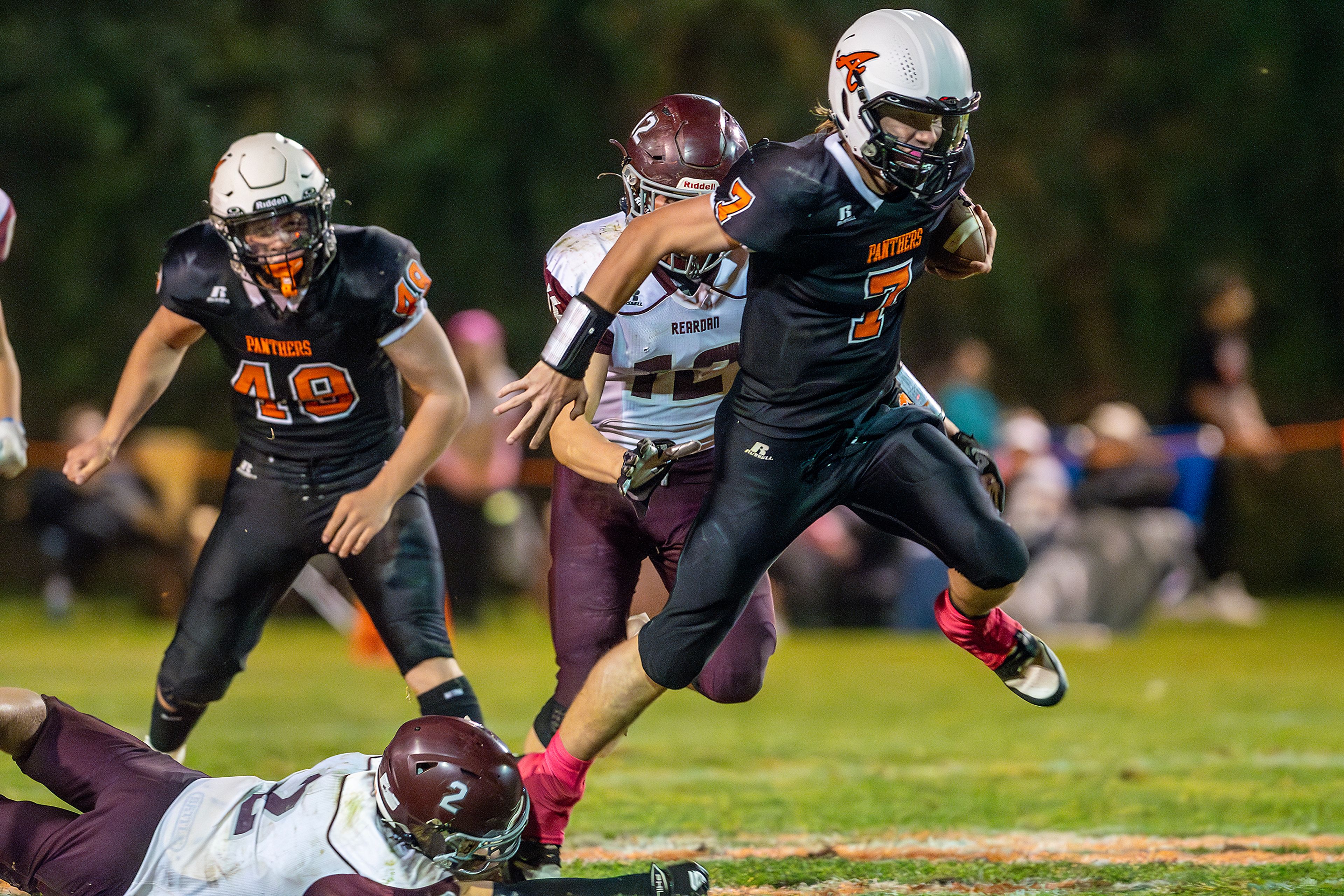 Asotin quarterback Cody Ells run the ball as Reardan�s Hunter Flaa attempts to stop him during a Northeast 2B League game Friday in Asotin.,