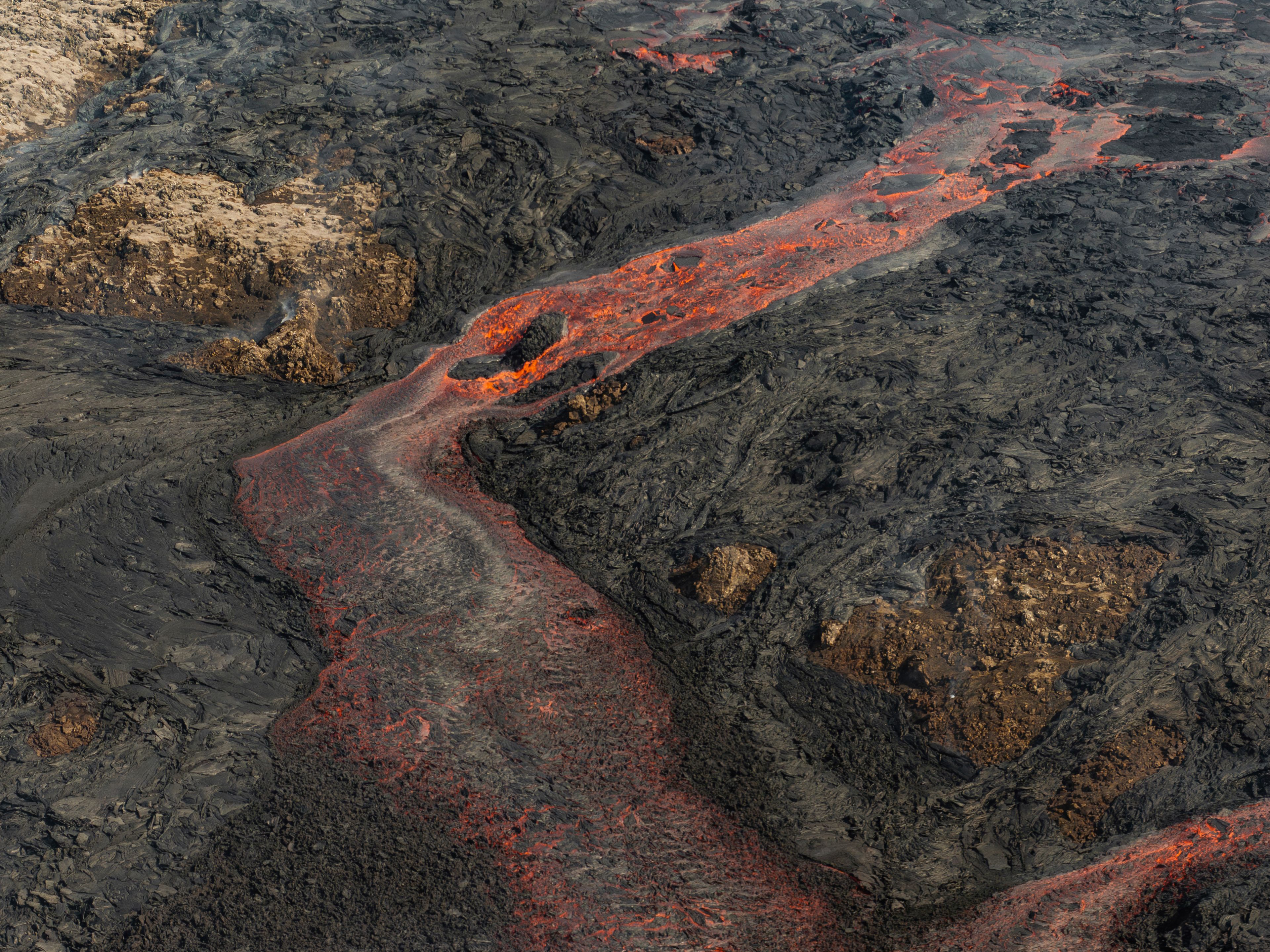 Lava flows from a volcano in Grindavik, Iceland, Wednesday, May 29, 2024. A volcano in southwestern Iceland erupted Wednesday for the fifth time since December, spewing red lava that once again threatened the coastal town of Grindavik and led to the evacuation of the popular Blue Lagoon geothermal spa.