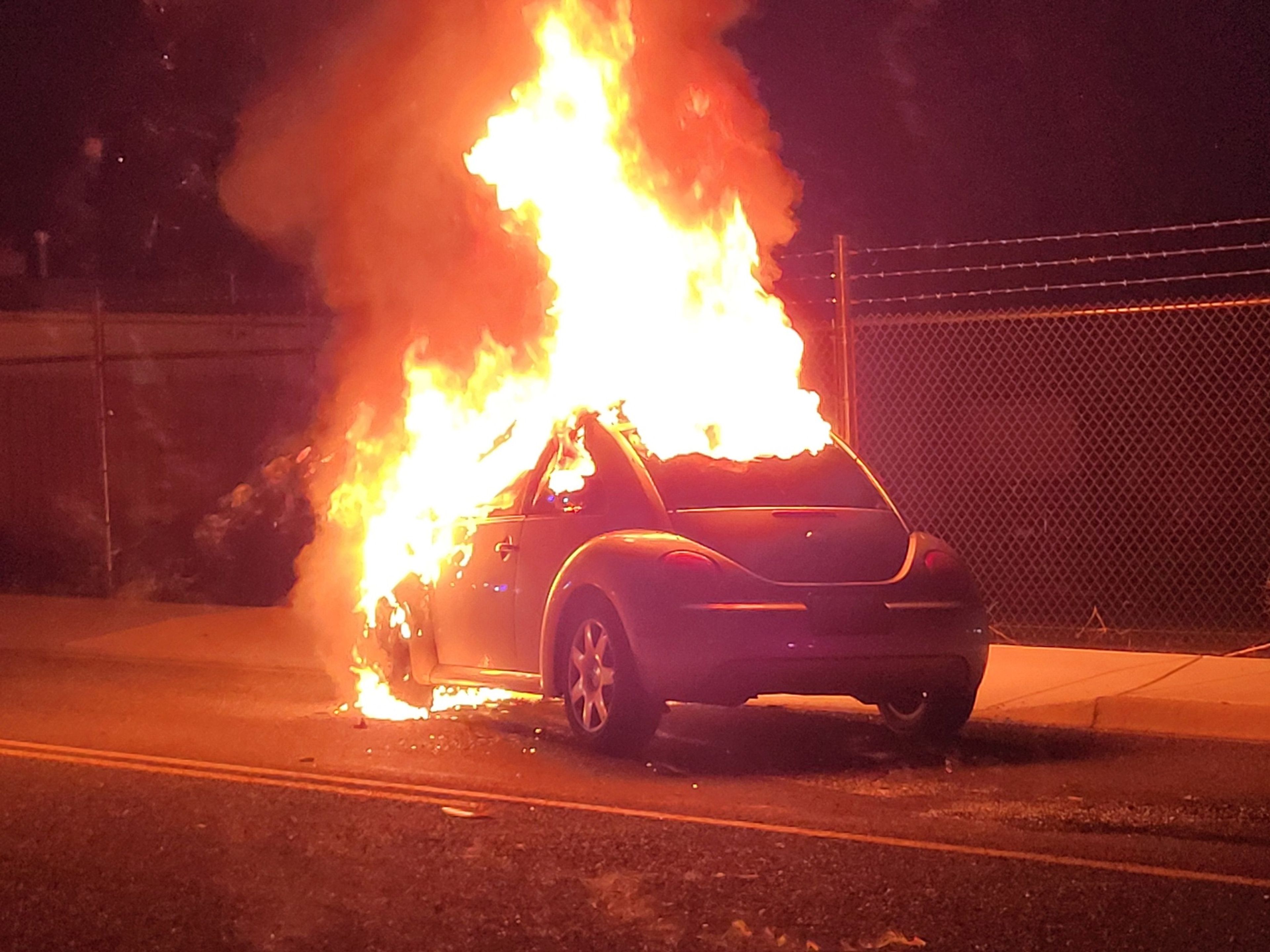 A Volkswagen Beetle is fully engulfed in flames after a rear-end collision Friday night in Clarkston.