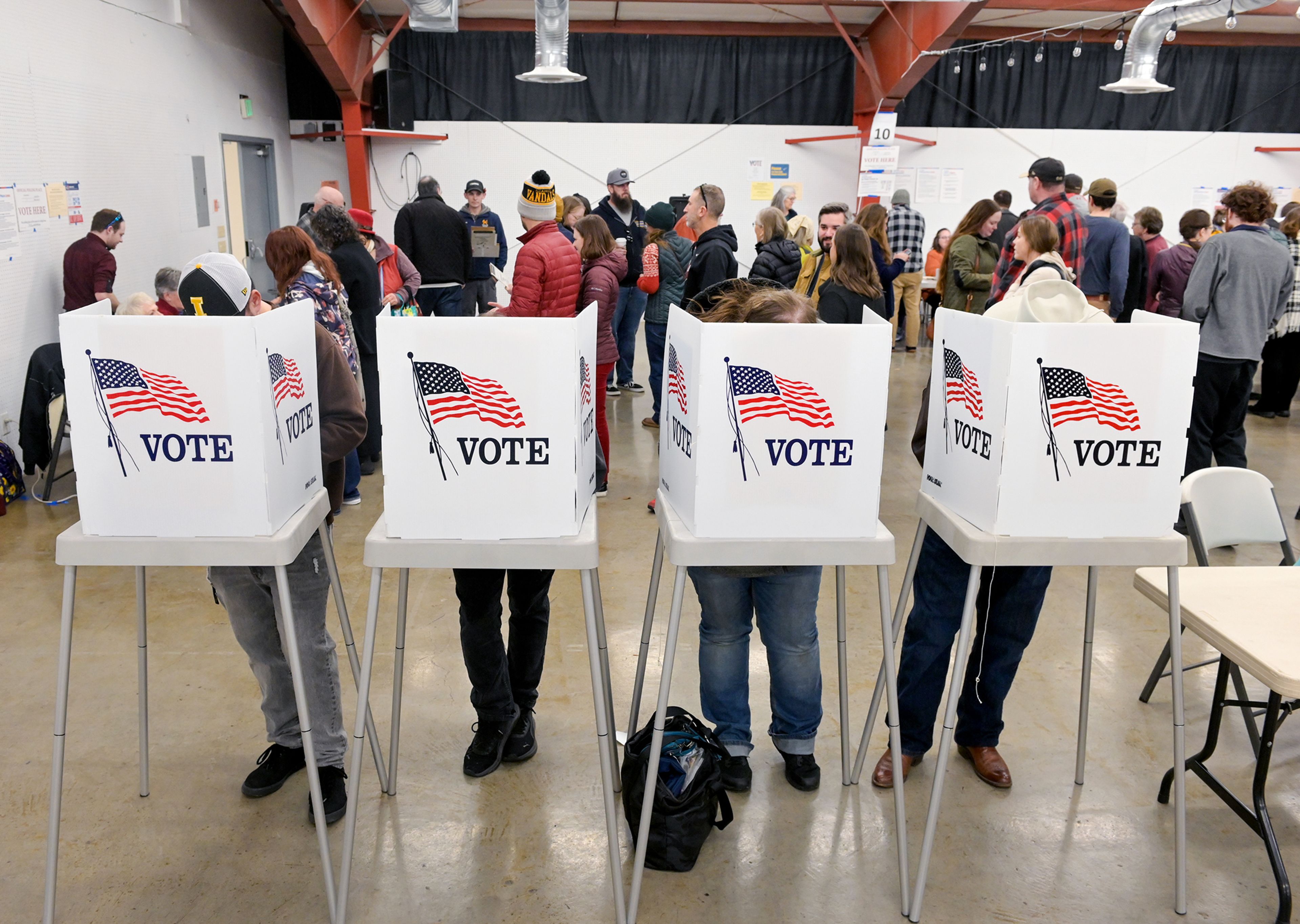 Voters fill a row of polling booths Tuesday as Election Day begins at the Latah County Events Center Tuesday in Moscow.