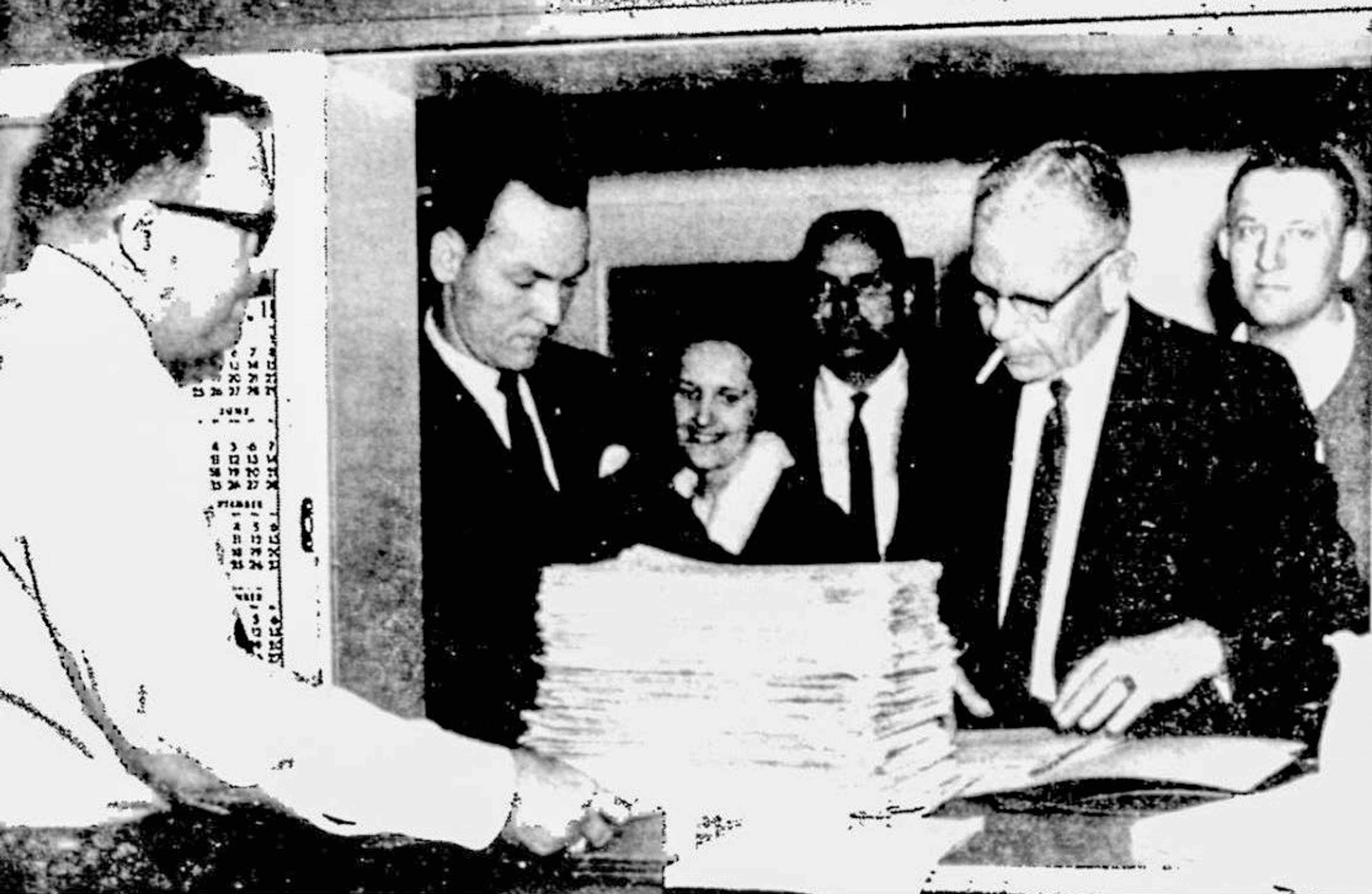 In this April 2, 1968, Lewiston Tribune file photo, City Clerk Wayne D. Rudd (left) accepted 1,974 petitions protesting annexation of Lewiston Orchards by the city of Lewiston. Making the presentation of the petitions at City Hall at 4 p.m. the previous afternoon were, from the left, J. Dan Willows, chairman of the Orchards Community Project; Mrs. Willows; Howard G. Jeppson, a project official; Attorney Owen L. Knowlton, legal adviser; and Irving Kalinoski, a leader in the protest movement and originator of a move to incorporate a separate city.