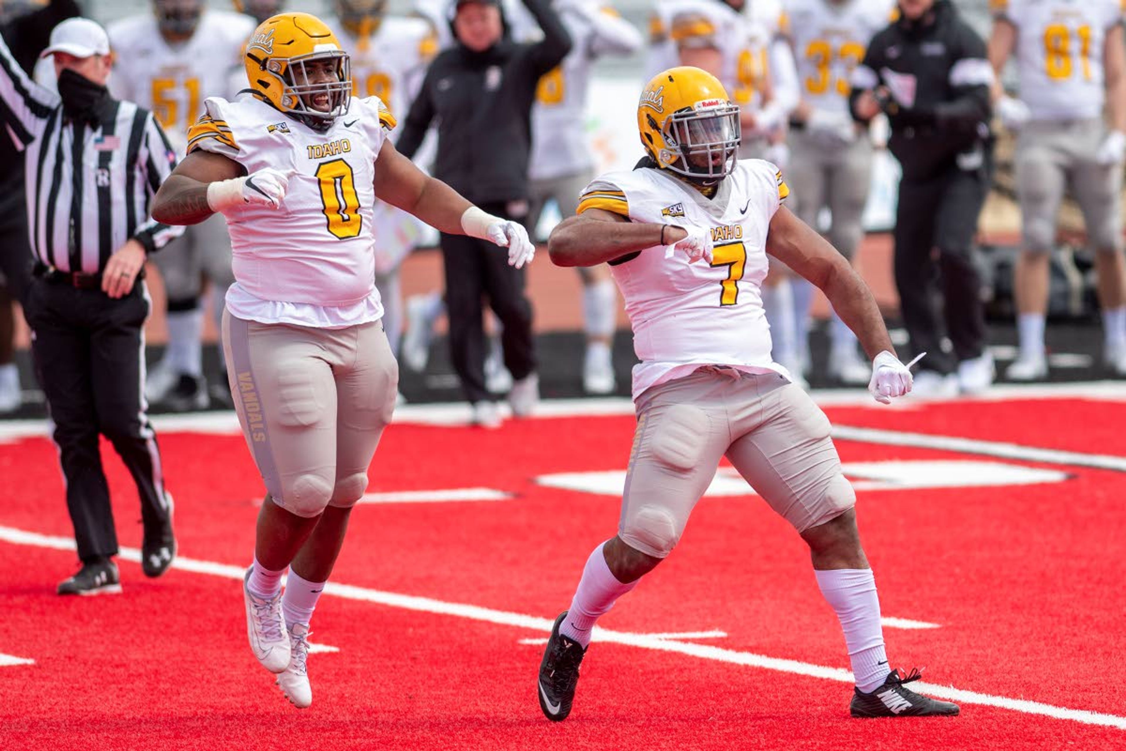 Idaho linebacker Charles Akanno, right, celebrates after making a tackle for loss to end the the first quarter of Saturday's Big Sky Conference matchup against Eastern Washington at Roos Field in Cheney, Wash.