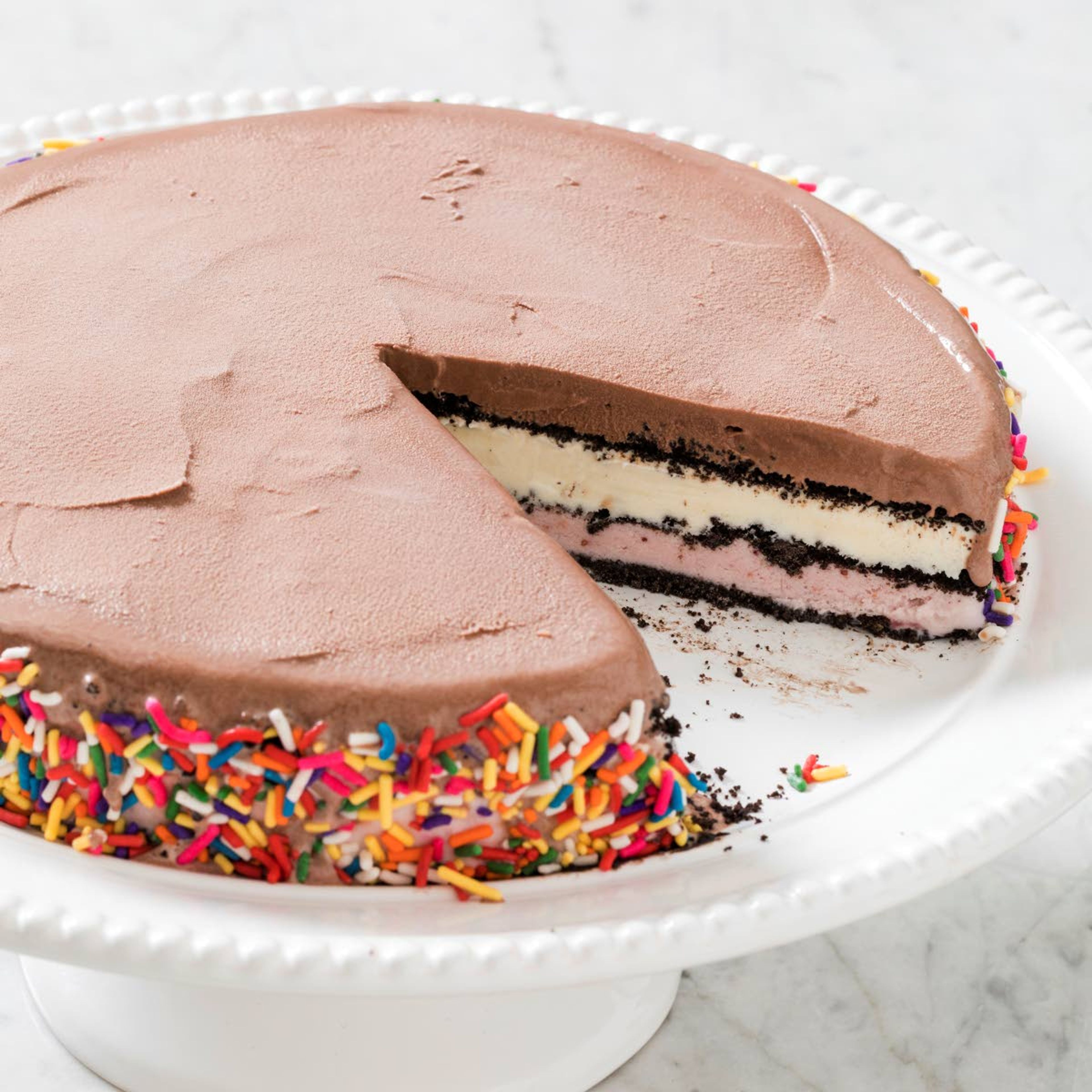 This undated photo provided by America’s Test Kitchen in July 2018 shows a basic ice cream cake in Brookline, Mass. This recipe appears in the cookbook “The Perfect Cake.” (Daniel J. van Ackere/America’s Test Kitchen via AP)