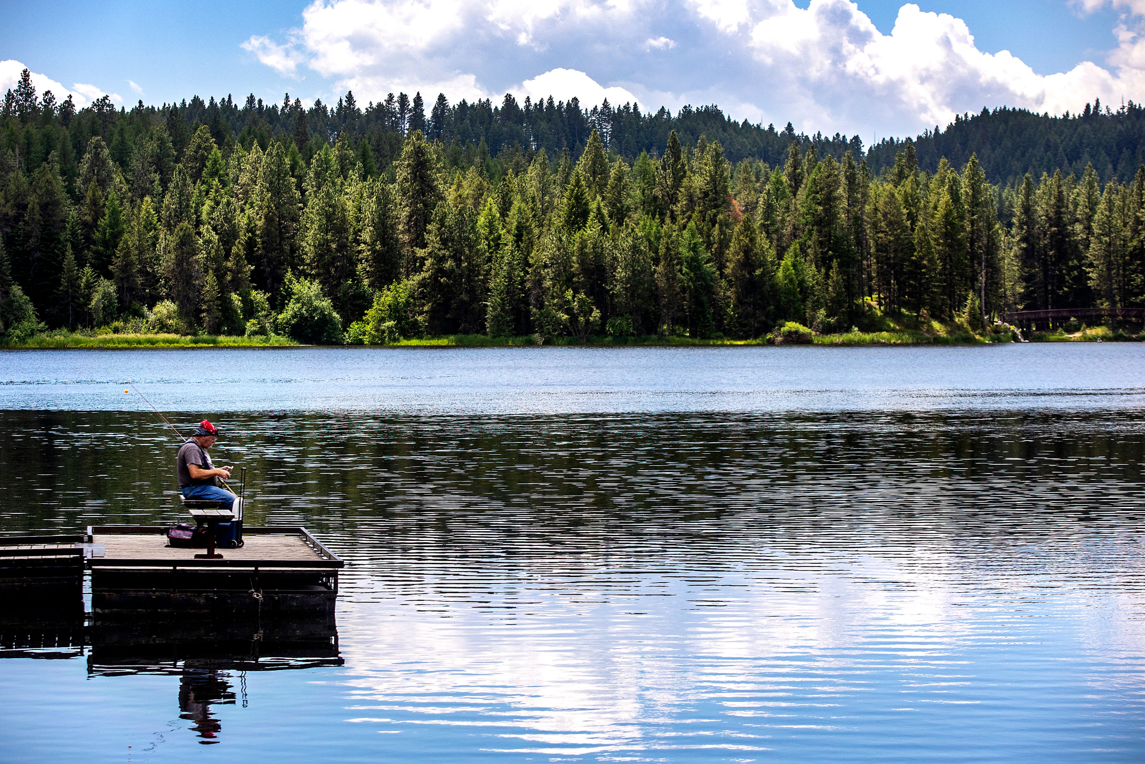 Gregg Presnell, of Lewiston, enjoys a cool day of fishing at Winchester Lake with clouds drifting by overhead during the summer of 2021.