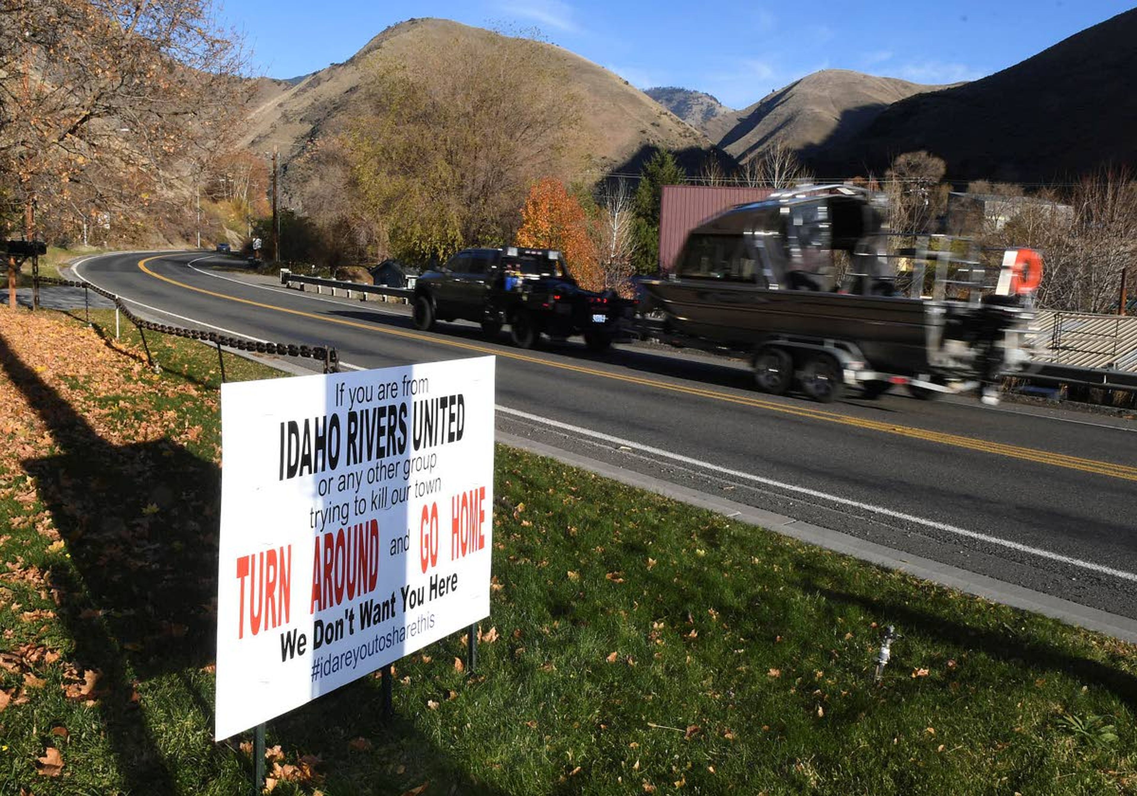 A sign on the south entrance to Riggins sends a stern message to those working to close steelhead fishing that that they are not welcome in the town.