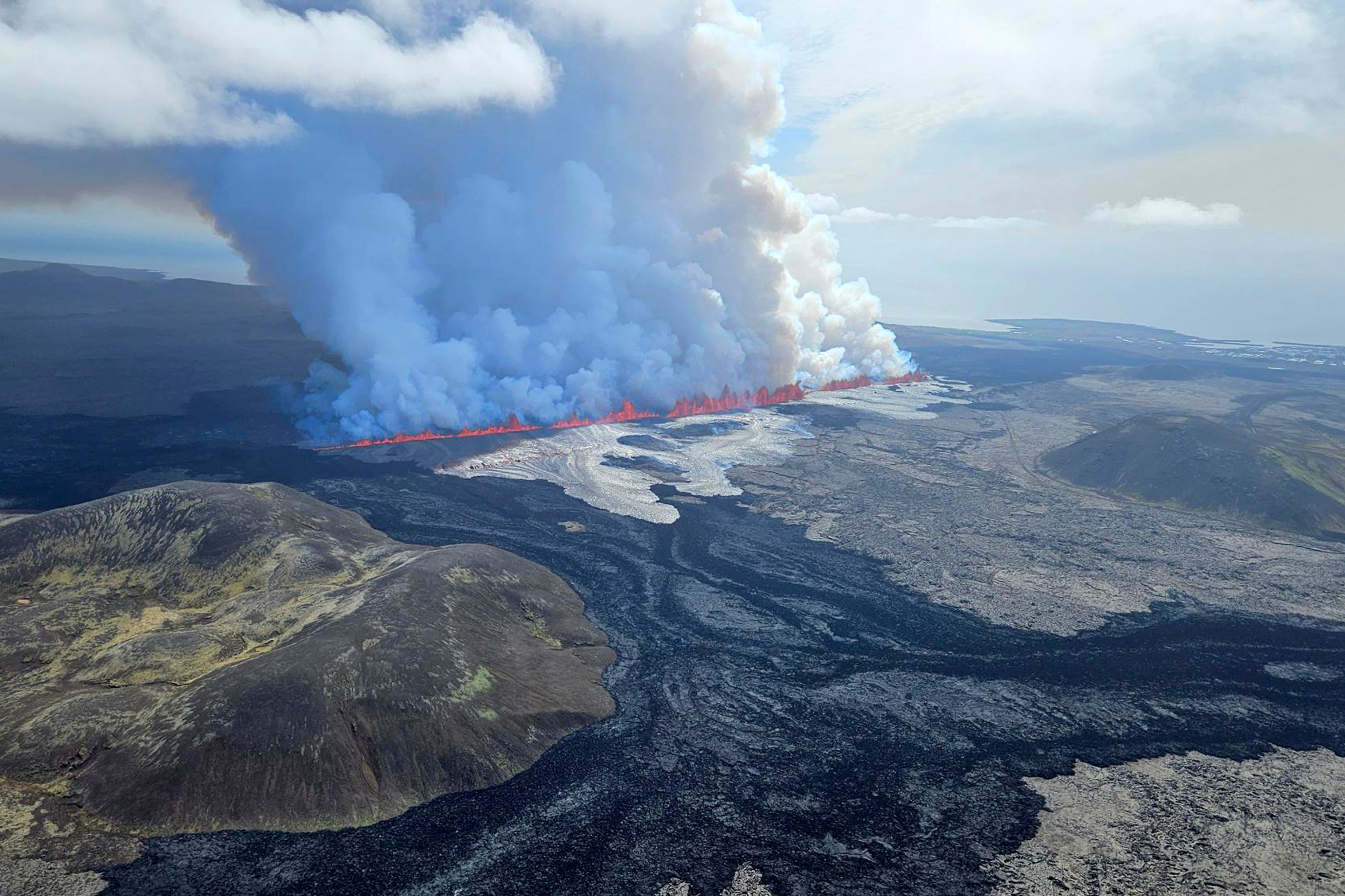 A volcano erupts in Grindavik, Iceland, Wednesday, May 29, 204. Wednesday, May 29, 2024. A volcano in southwestern Iceland is erupting, spewing red streams of lava in its latest display of nature’s power. A series of earthquakes before the eruption Wednesday triggered the evacuation of the popular Blue Lagoon geothermal spa. The eruption began in the early afternoon north of Grindavik, a coastal town of 3,800 people that was also evacuated.