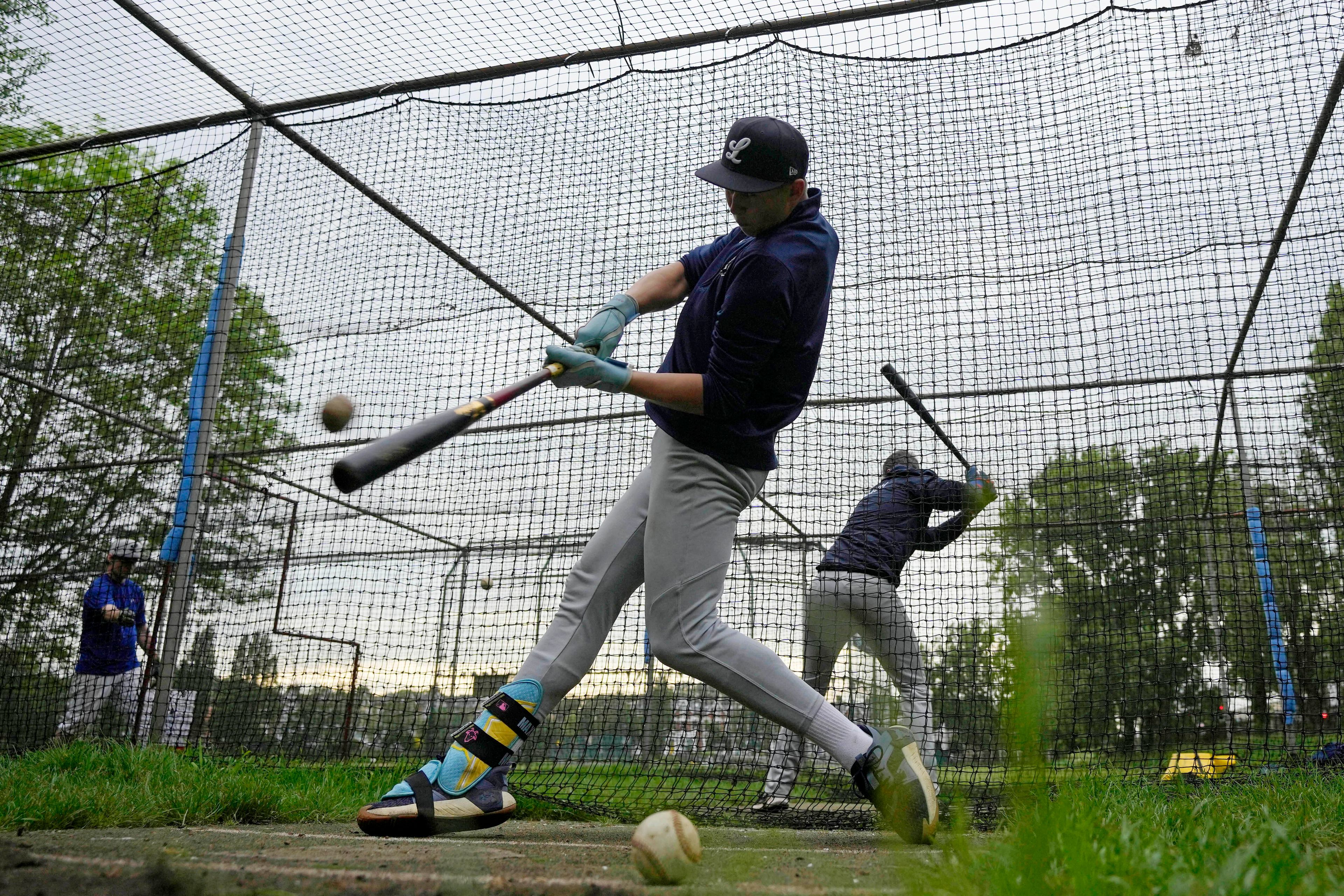 Members of the UK baseball team London Mets practice during a training session at the Finsbury Park in London, Thursday, May 16, 2024. Baseball at the highest club level in Britain is competitive. Teams are mélange of locals and expats some with college and minor league experience.