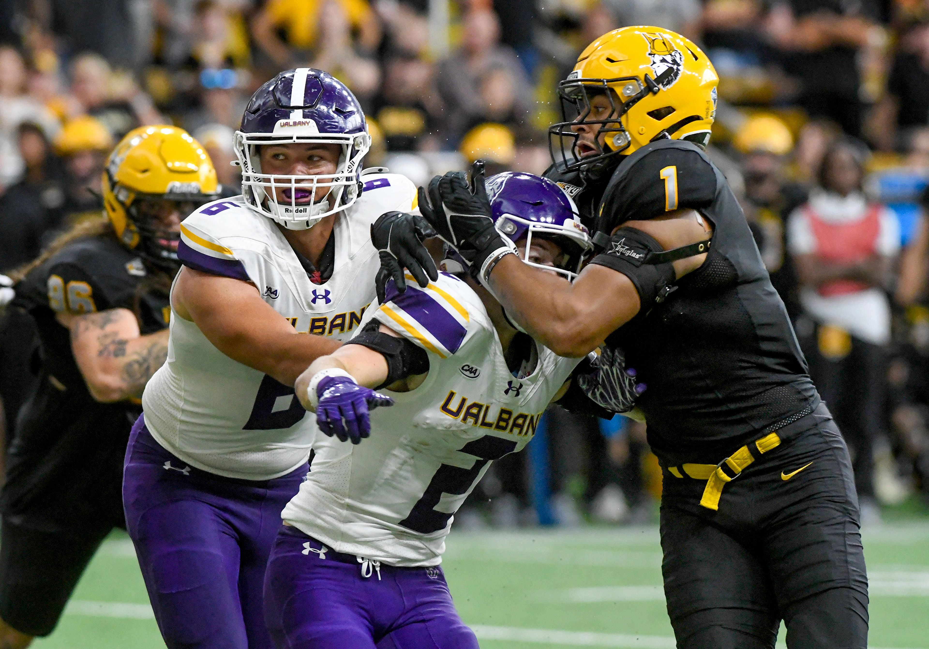 Idaho Vandals defensive lineman Keyshawn James-Newby (1) blocks Albany Great Danes offense Saturday at the P1FCU Kibbie Dome in Moscow.,