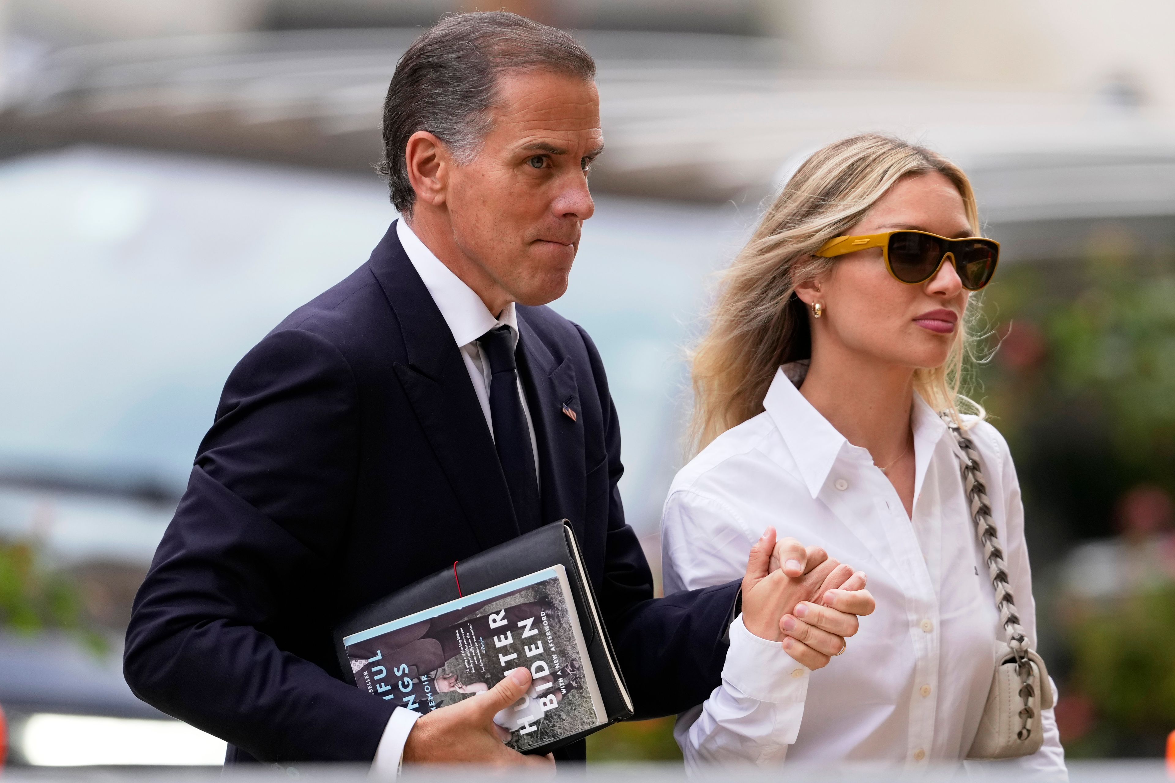 Hunter Biden, left, arrives to federal court with his wife, Melissa Cohen Biden, Thursday, June 6, 2024, in Wilmington, Del.