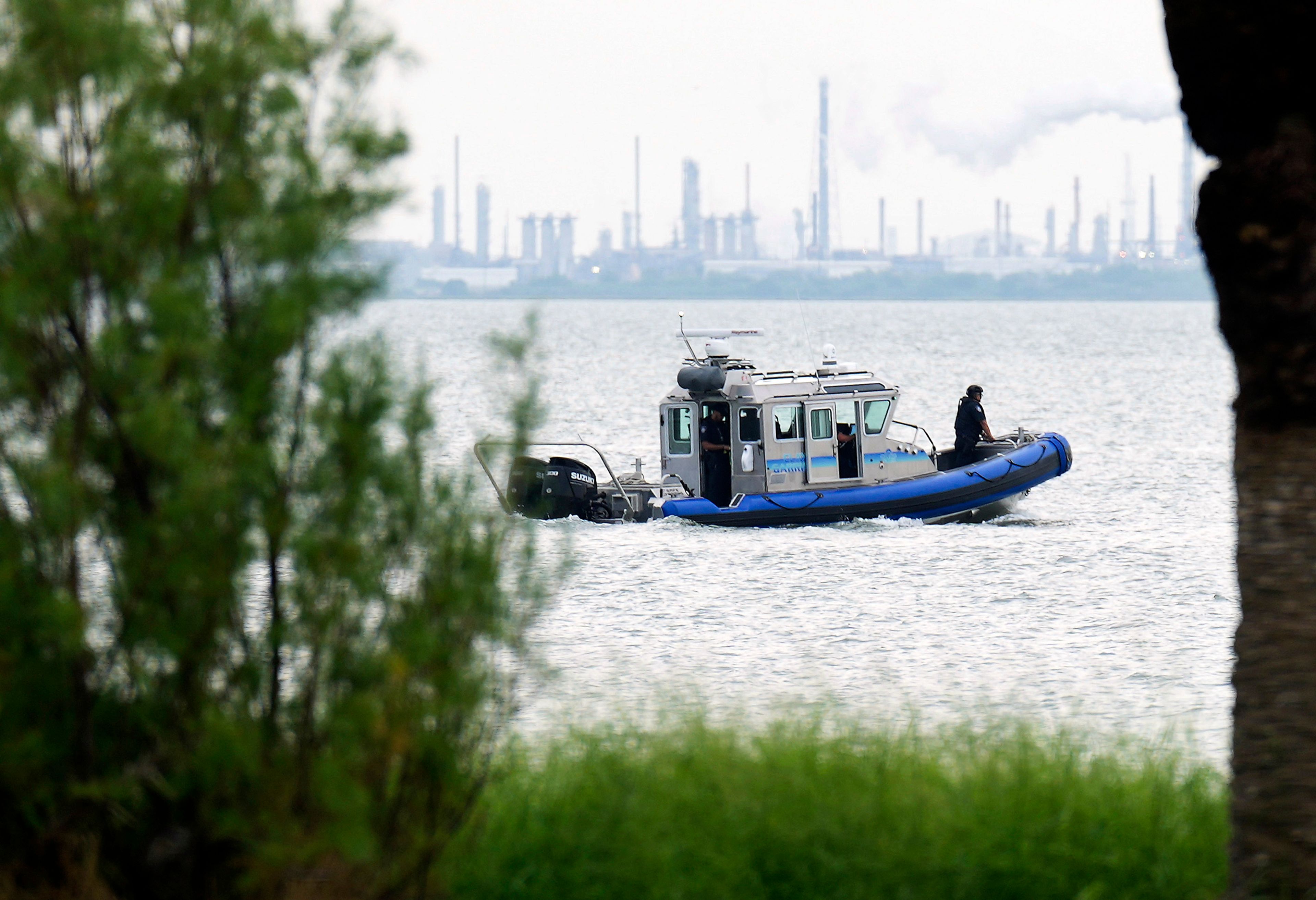 A police boat patrols near where a car was pulled out of the Galveston Ship Channel Tuesday, Sept. 3, 2024 in Galveston, Texas, following the fatal shooting of a Texas deputy constable in Houston. A suspect led authorities on a 60 miles chase that ended in the waters off Galveston, where the man tried swimming away to evade arrest before being captured with the help of a marine unit, according to the Port of Galveston Police Department.