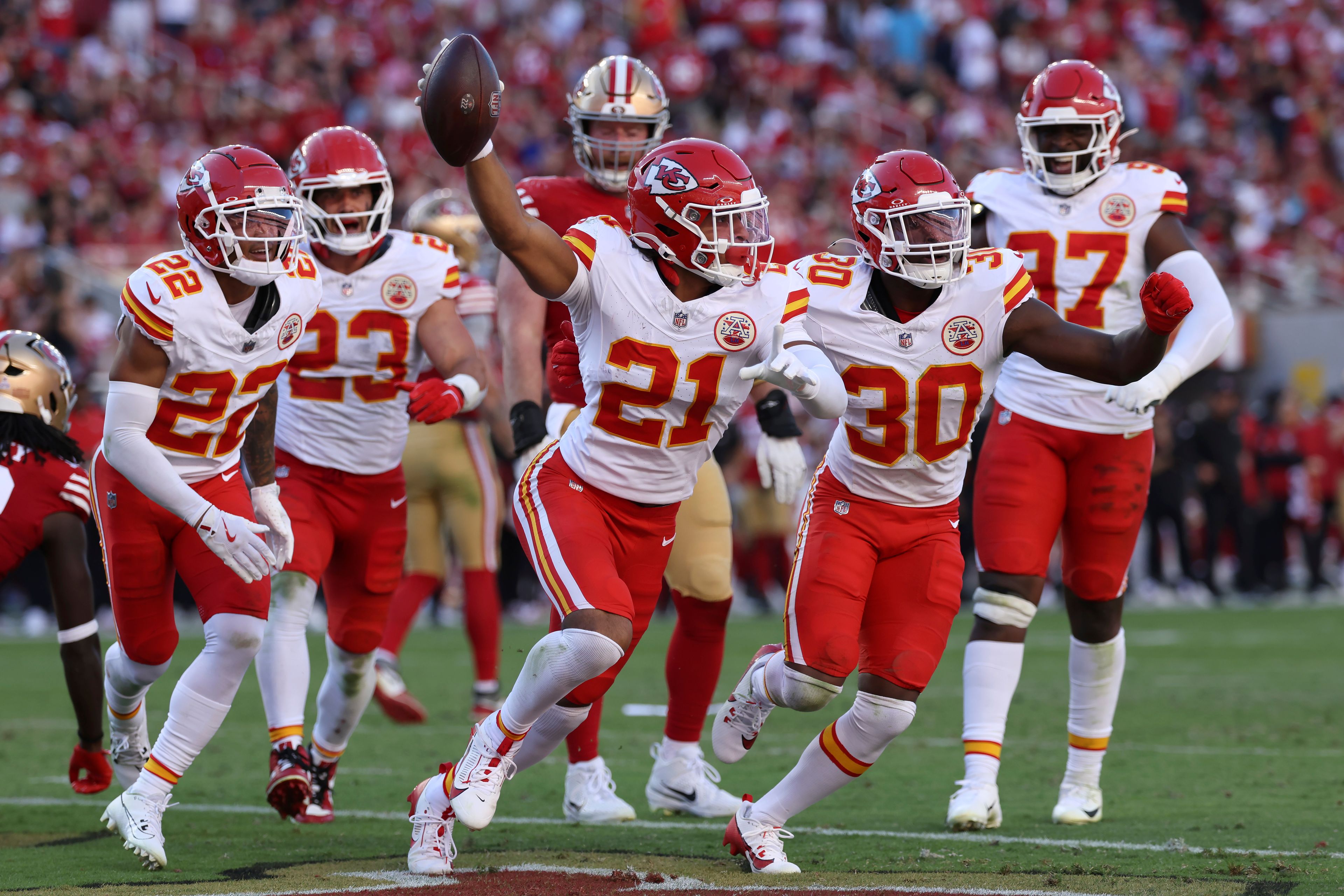 Kansas City Chiefs safety Jaden Hicks (21) celebrates with teammates after intercepting a pass during the second half of an NFL football game against the San Francisco 49ers in Santa Clara, Calif., Sunday, Oct. 20, 2024. (AP Photo/Jed Jacobsohn)