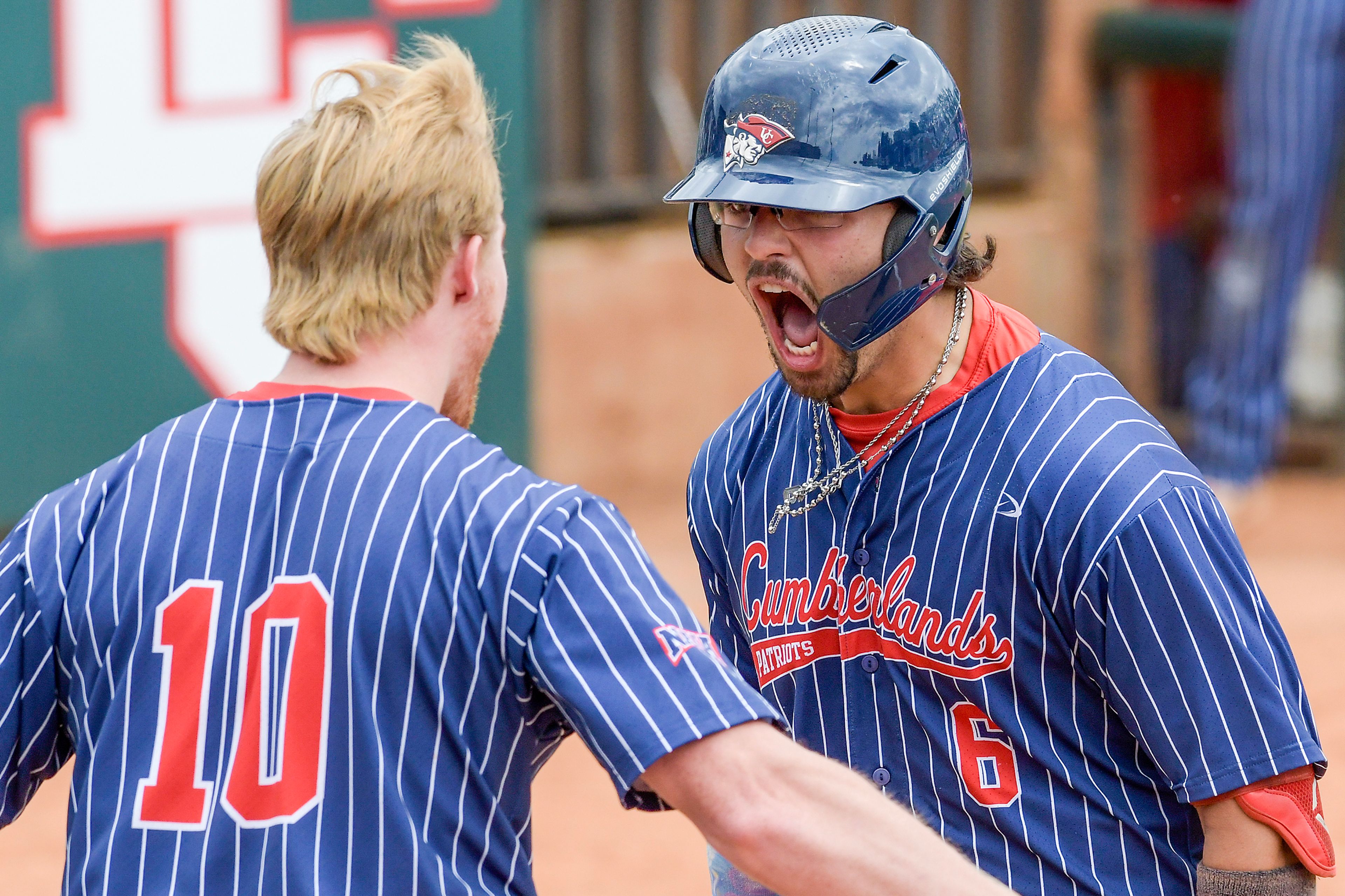 Cumberlands’ Charlie Muñiz lets out a yell as he comes into home base on a home run that scored four runs against William Carey in an inning of game 6 of the NAIA World Series at Harris Field on Saturday in Lewiston.