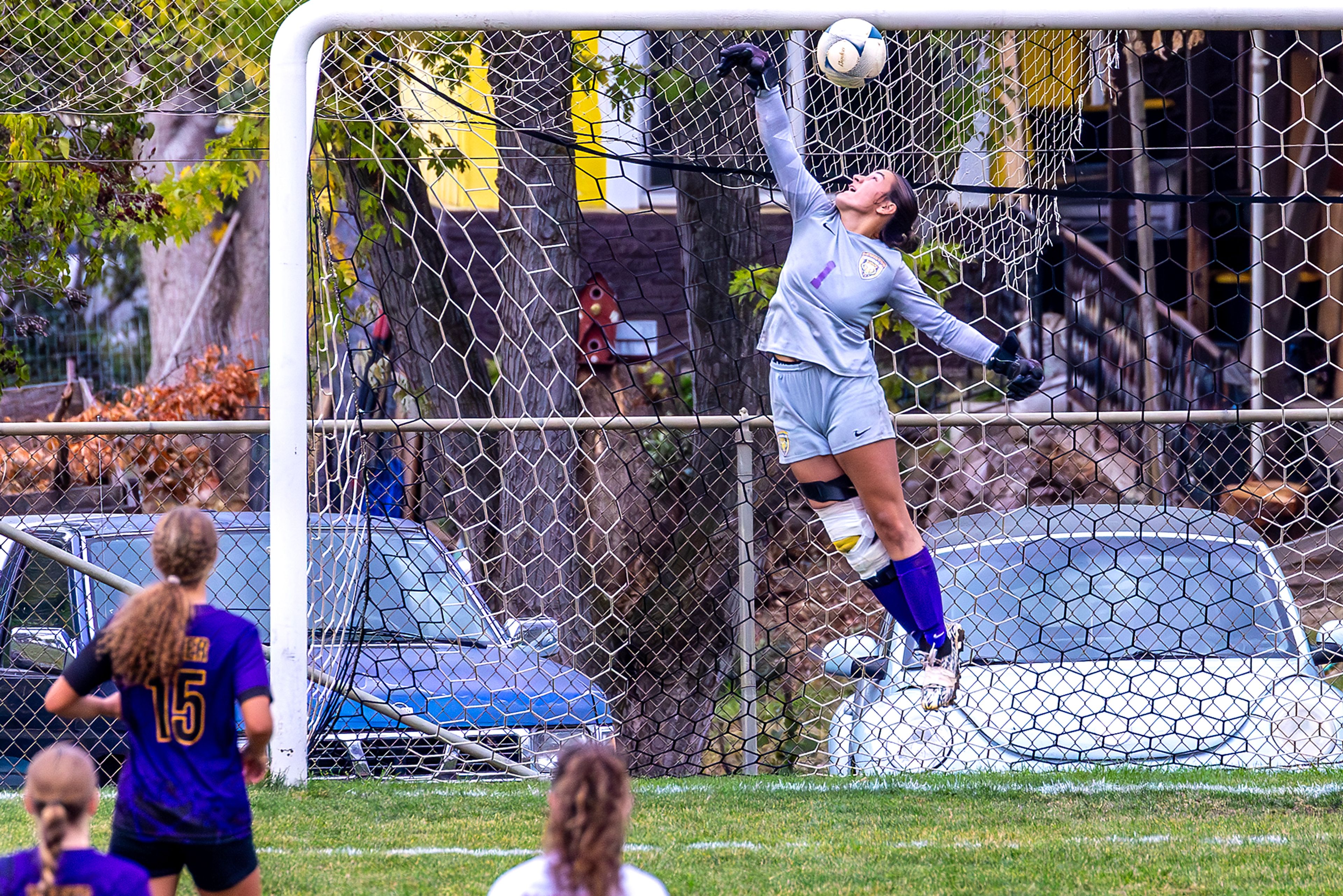 Lewiston goalkeeper Solana Inzunza leaps up as a Sandpoint goal goes into the net in the 5A Inland Empire League District Championship Wednesday at Walker Field in Lewiston.,