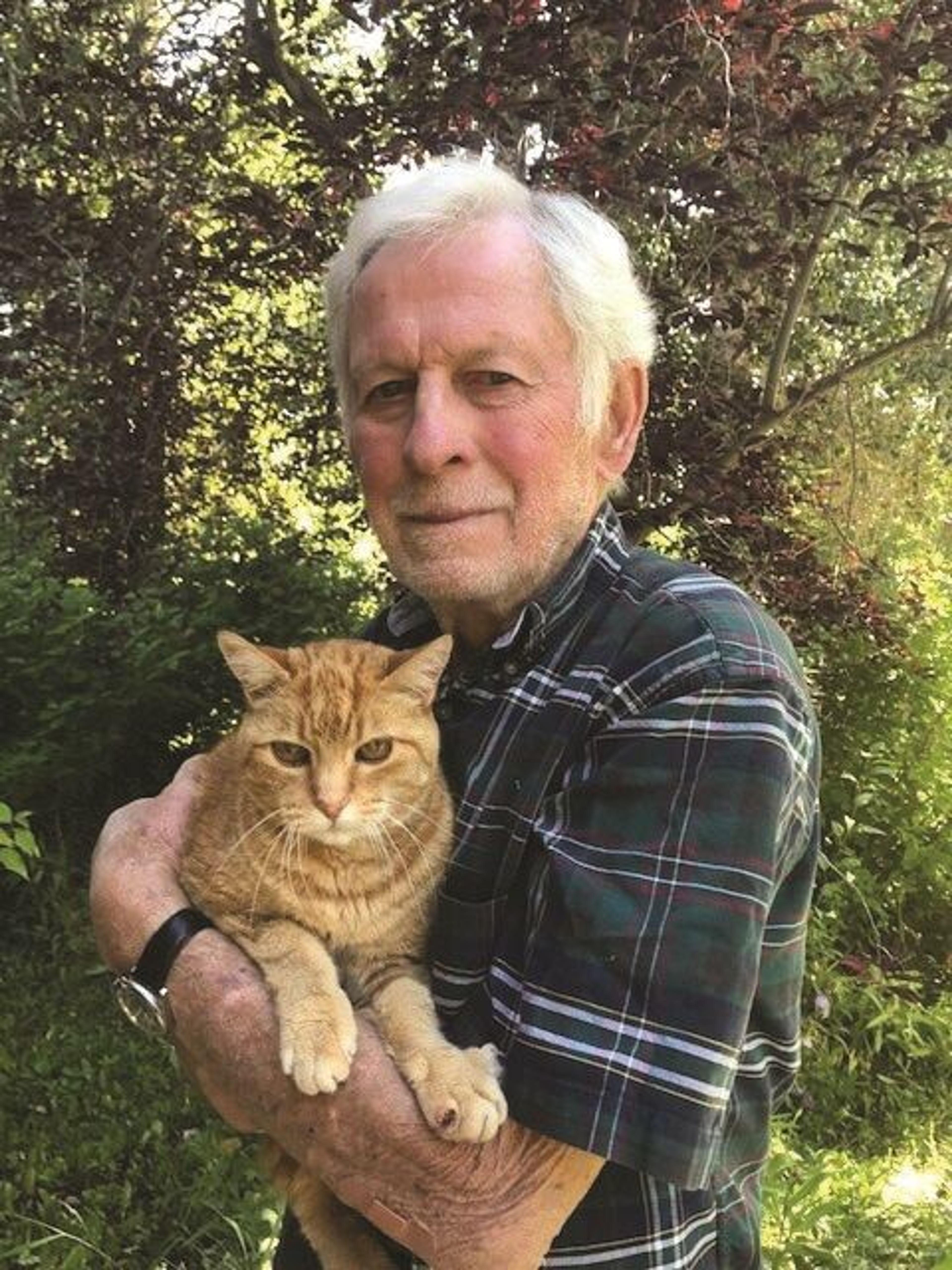 Maurice Hornocker holds Redd, his 17-year-old Manx.