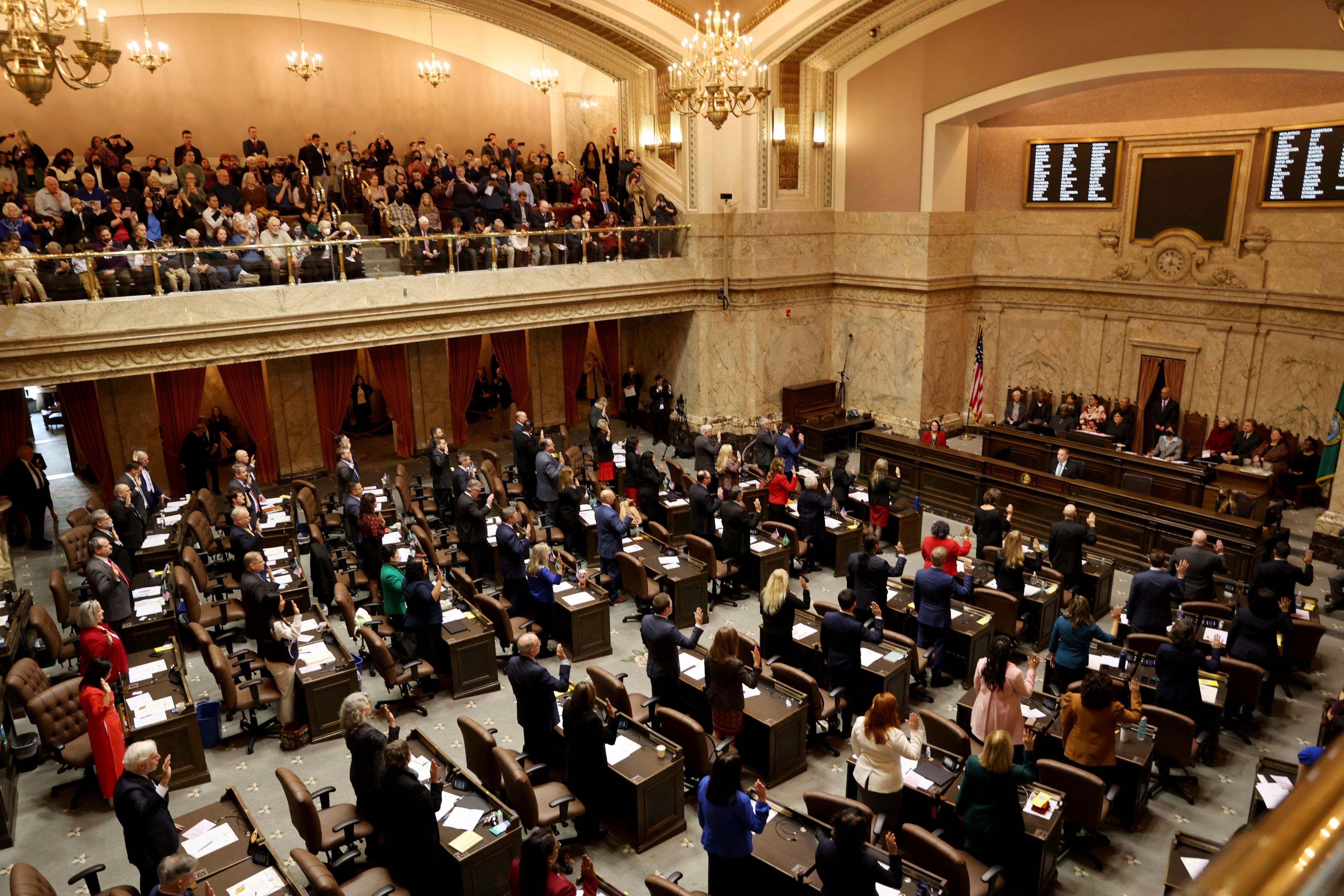 Legislators swear in on the first day of the legislative session at the Washington state Capitol in Olympia, Wash., on Monday, Jan. 9, 2023. (Karen Ducey/The Seattle Times via AP)