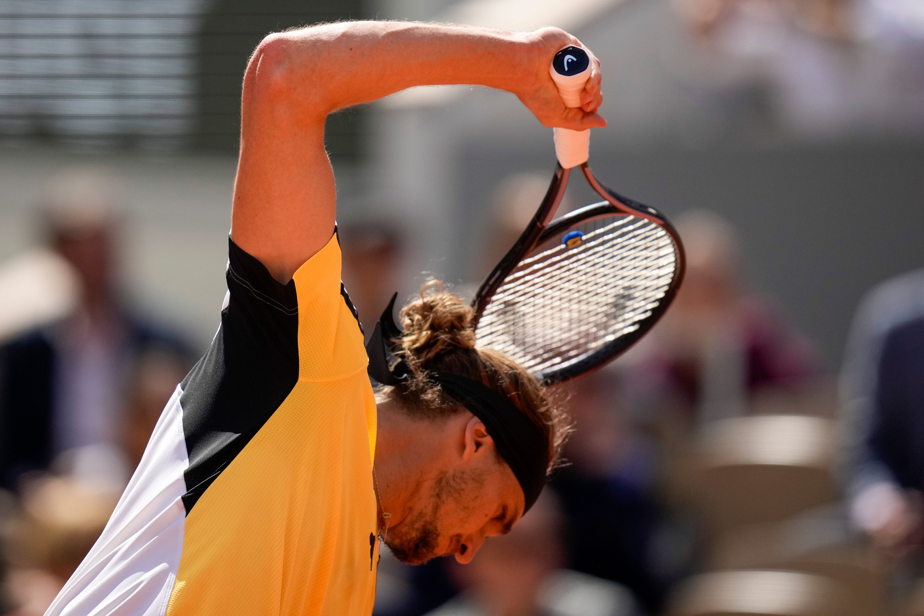 Germany's Alexander Zverev reacts after missing a shot against Spain's Carlos Alcaraz during the men's final of the French Open tennis tournament at the Roland Garros stadium in Paris, France, Sunday, June 9, 2024.