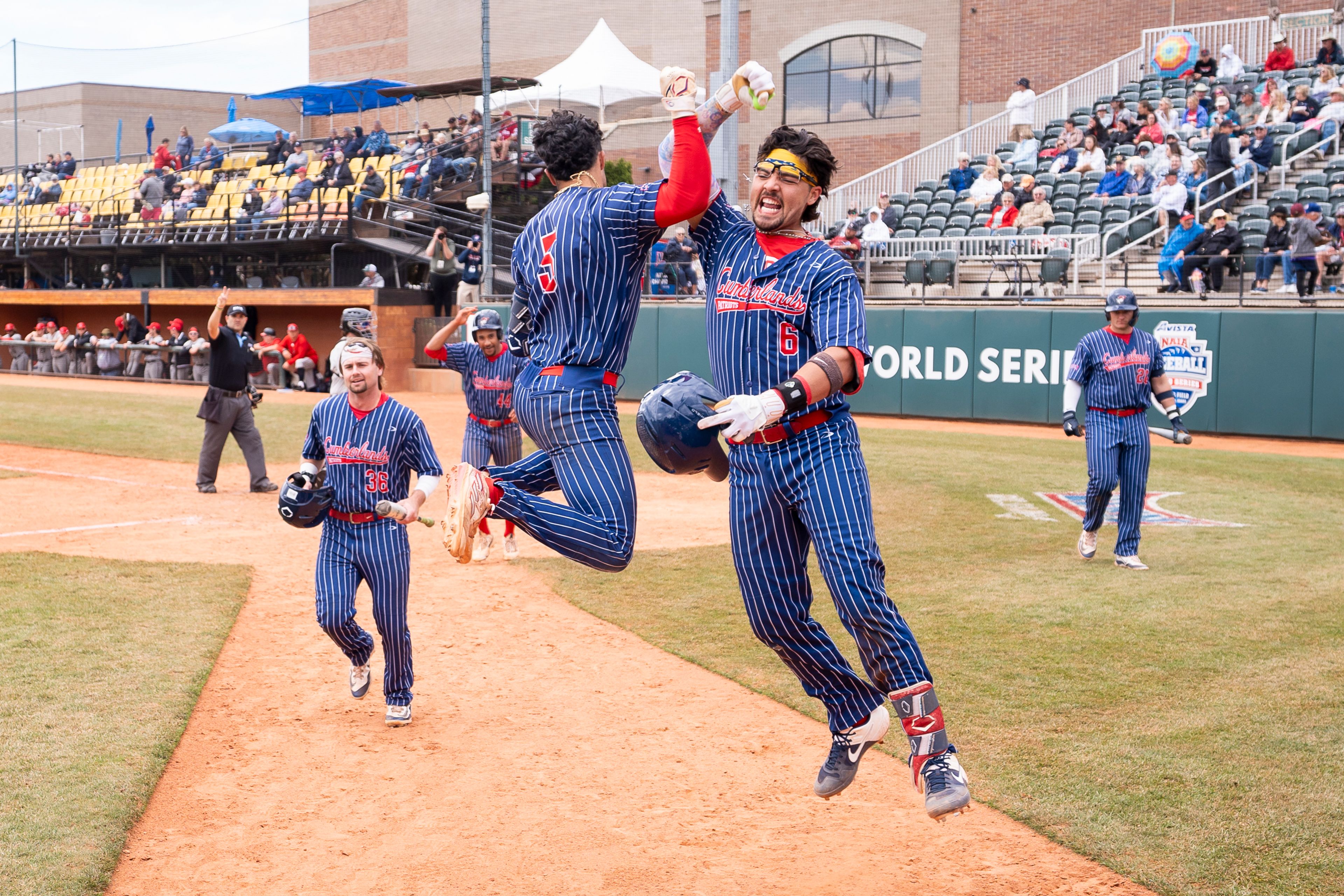 Cumberlands' Charlie Muñiz (6) celebrates with teammates after hitting a go-ahead grand slam during game 6 of the NAIA World Series against William Carey on Saturday at Harris Field in Lewiston.