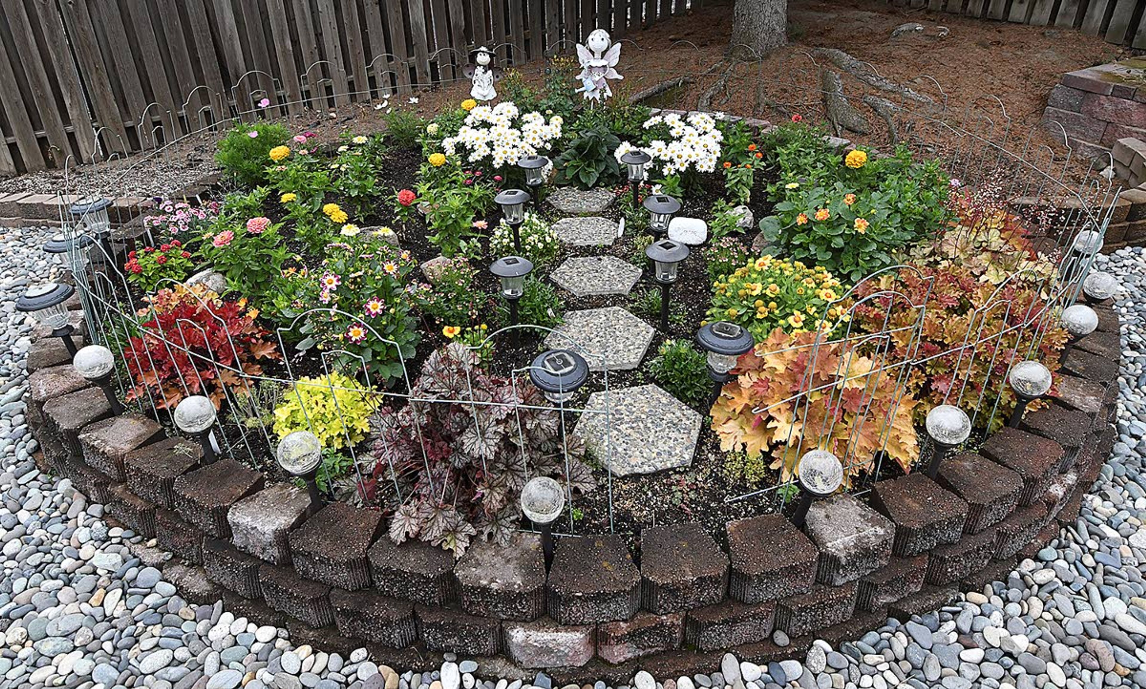 Glenn Thompson ripped out a corner of overgrown shrubs to create this circular garden for his wife.