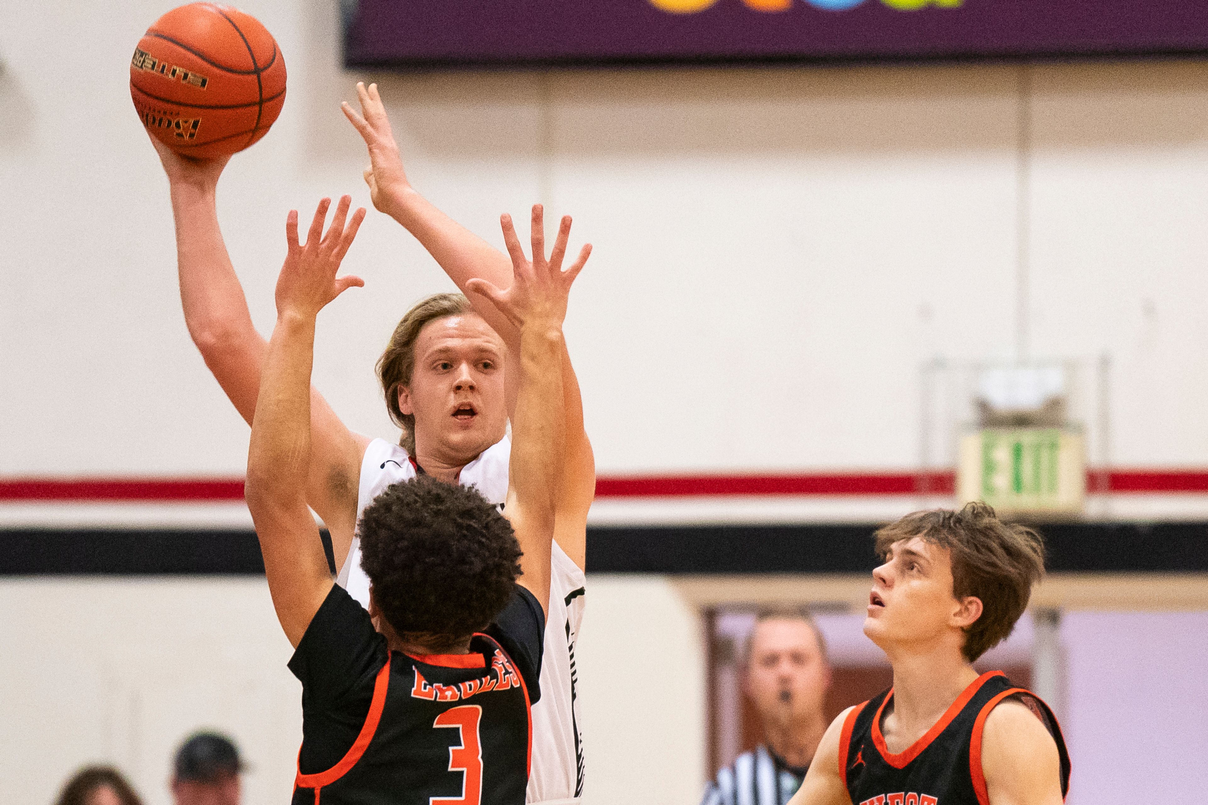 Clarkston’s Ian Moore (42) attempts to pass the ball as he is being double-teamed during their game against West Valley on Tuesday at Clarkston High School.