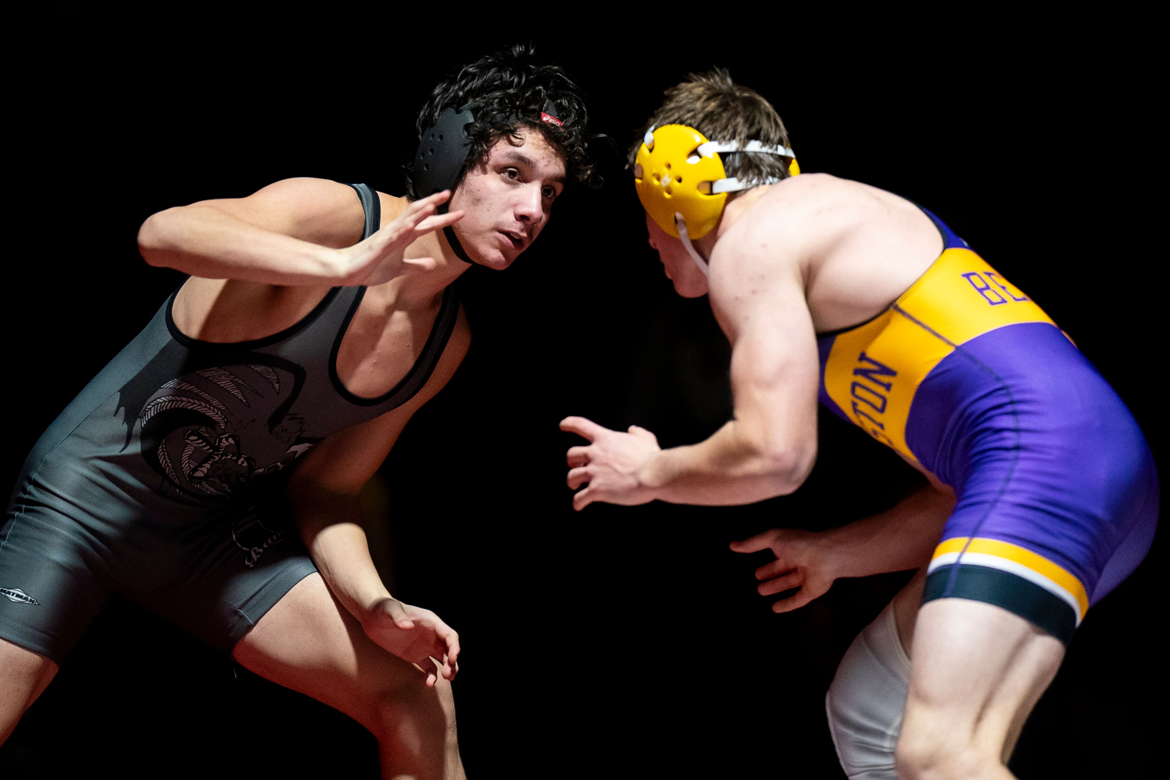 Clarkston’s Tommy Samuels, left, hand-fights with Lewiston’s Austin Crea during a 150-pound match Wednesday at Kramer Gym in Clarkston.