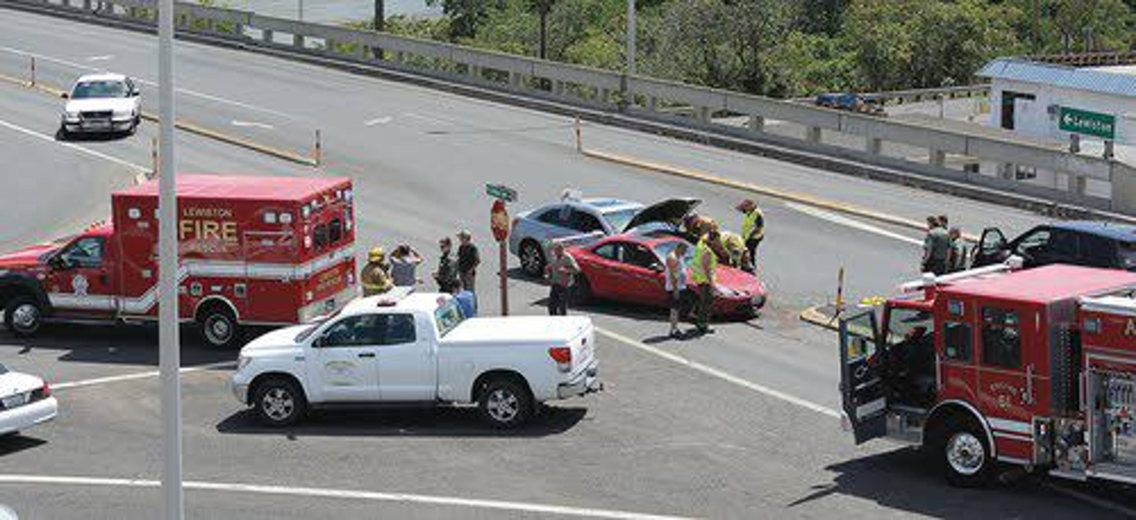 Law enforcement rescue crews from Lewiston and Clarkston work to sort out the cause of a two-car accident at about 1 p.m. Wednesday at the intersection of Fleshman Way and the Southway Bridge. Three people were taken to St. Joseph Regional Medical Center after one person was injured in the crash, according to Asotin County officials.