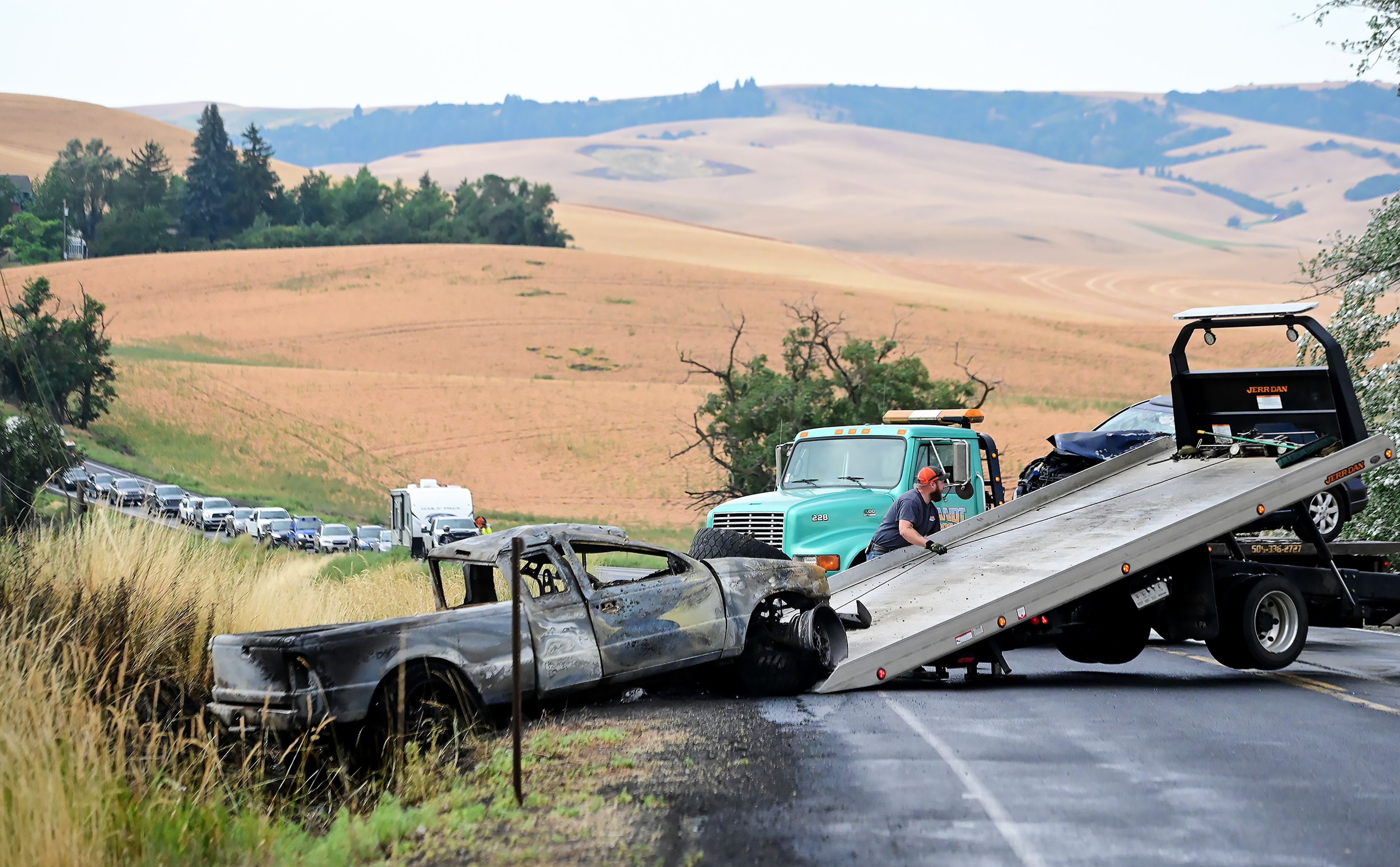 A truck gets pulled away following a crash on US Highway 95 south of Moscow on Monday.