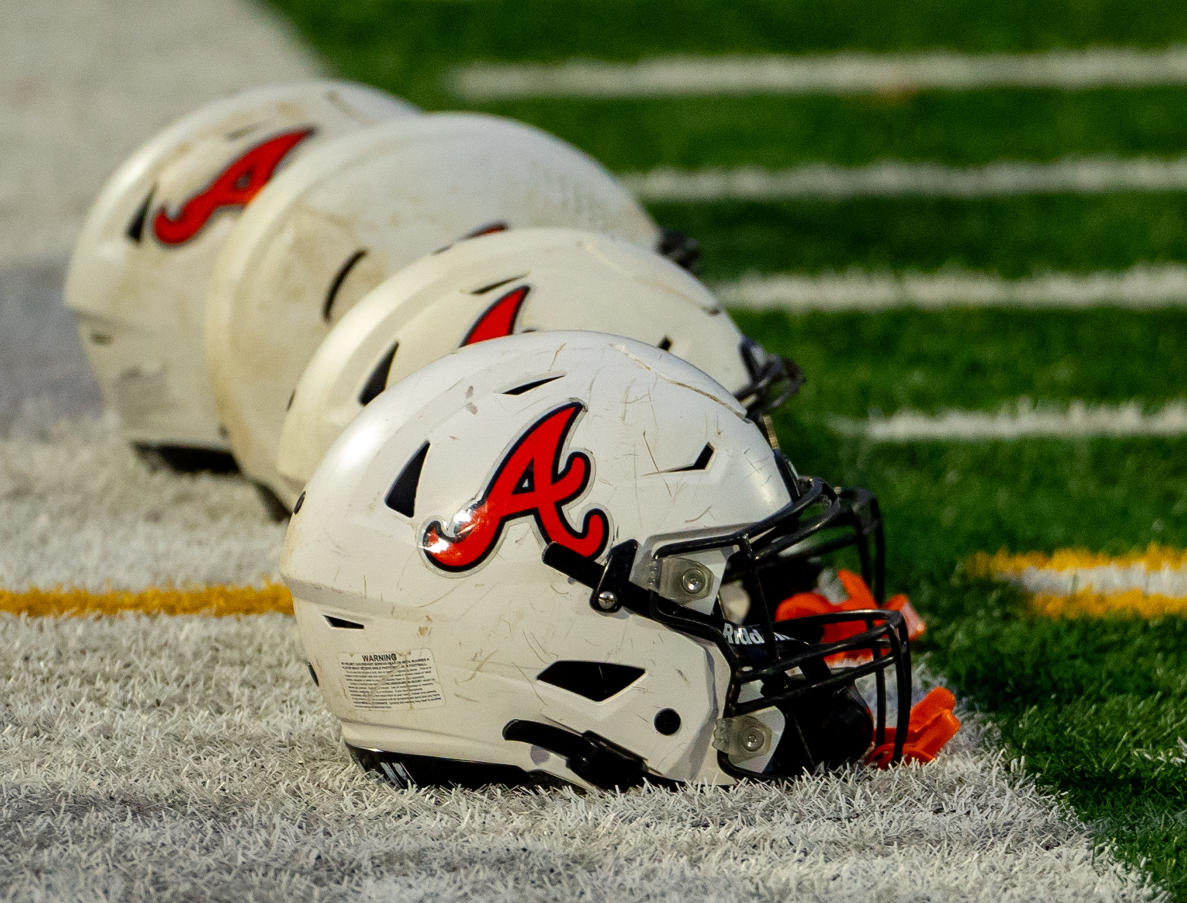 Asotin football helmets are shown on the sideline during a semifinal game against Napavine in the Washington 2B state tournament Saturday in Richland.