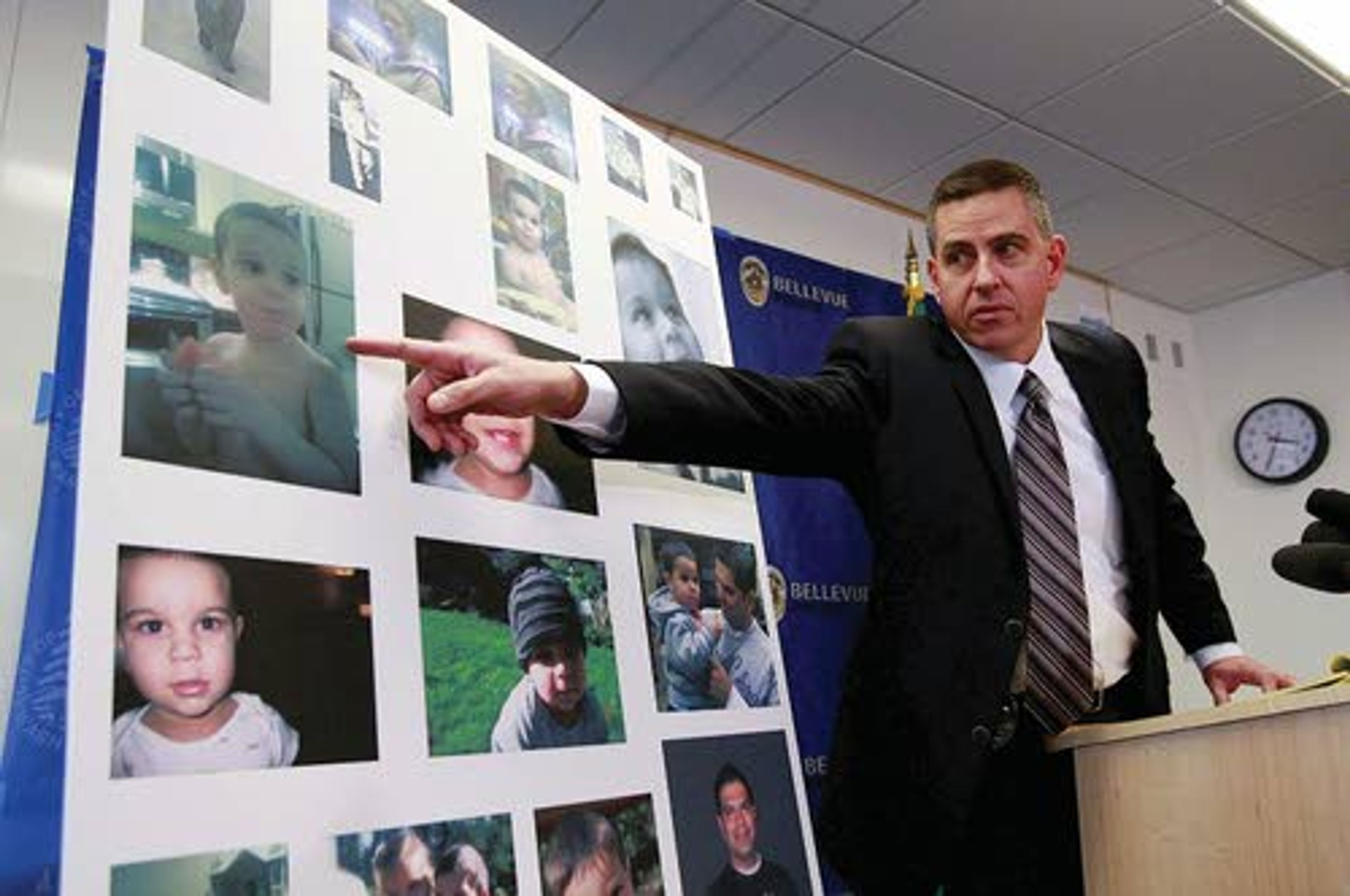 Maj. Mike Johnson of the Bellevue Police Department goes over
newly released images of Sky Metalwala and his mother, Julia,
during a news conference Friday in Bellevue, Wash.