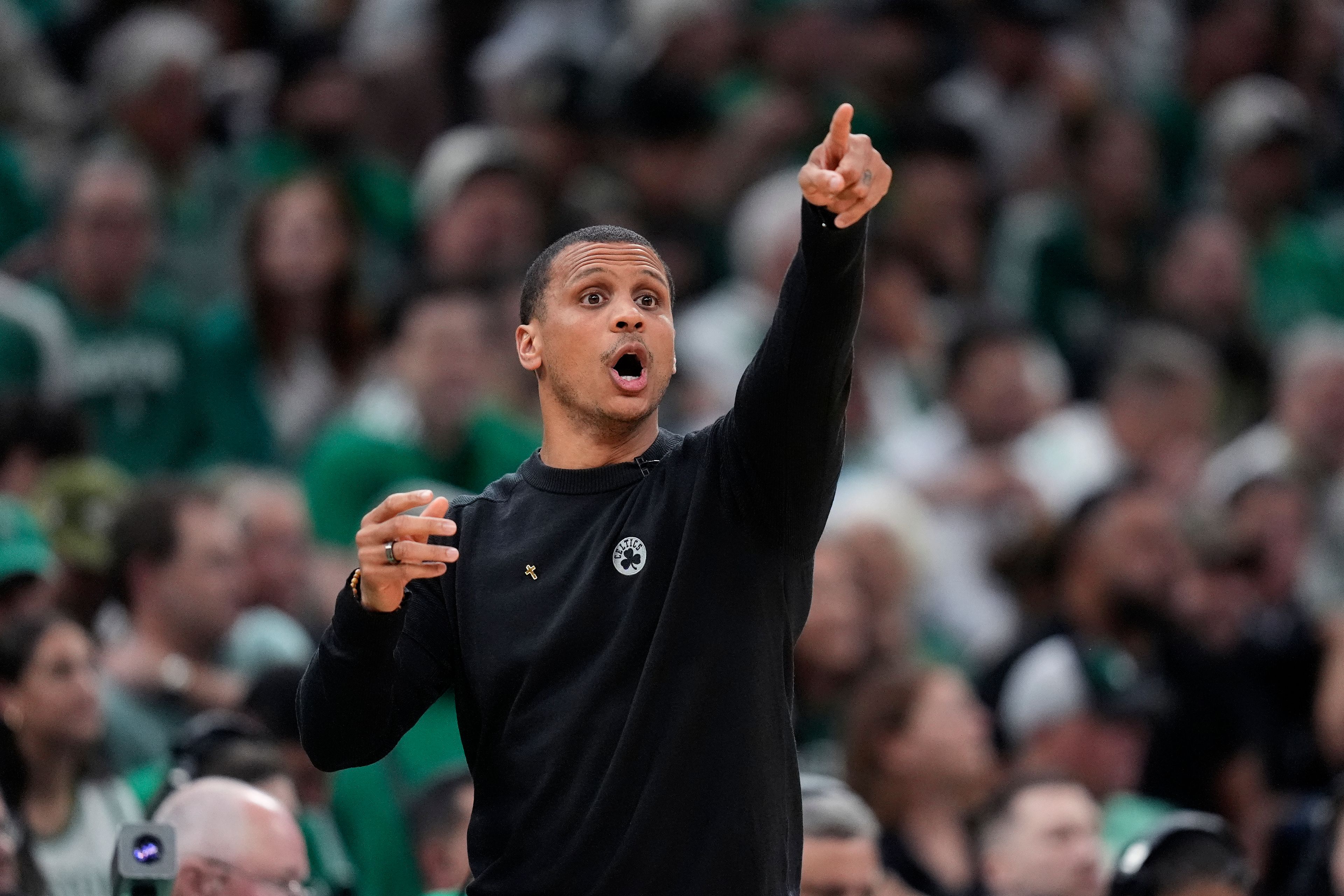 Boston Celtics coach Joe Mazzulla calls to players during the first half of Game 1 of the basketball team's NBA Finals against the Dallas Mavericks, Thursday, June 6, 2024, in Boston.