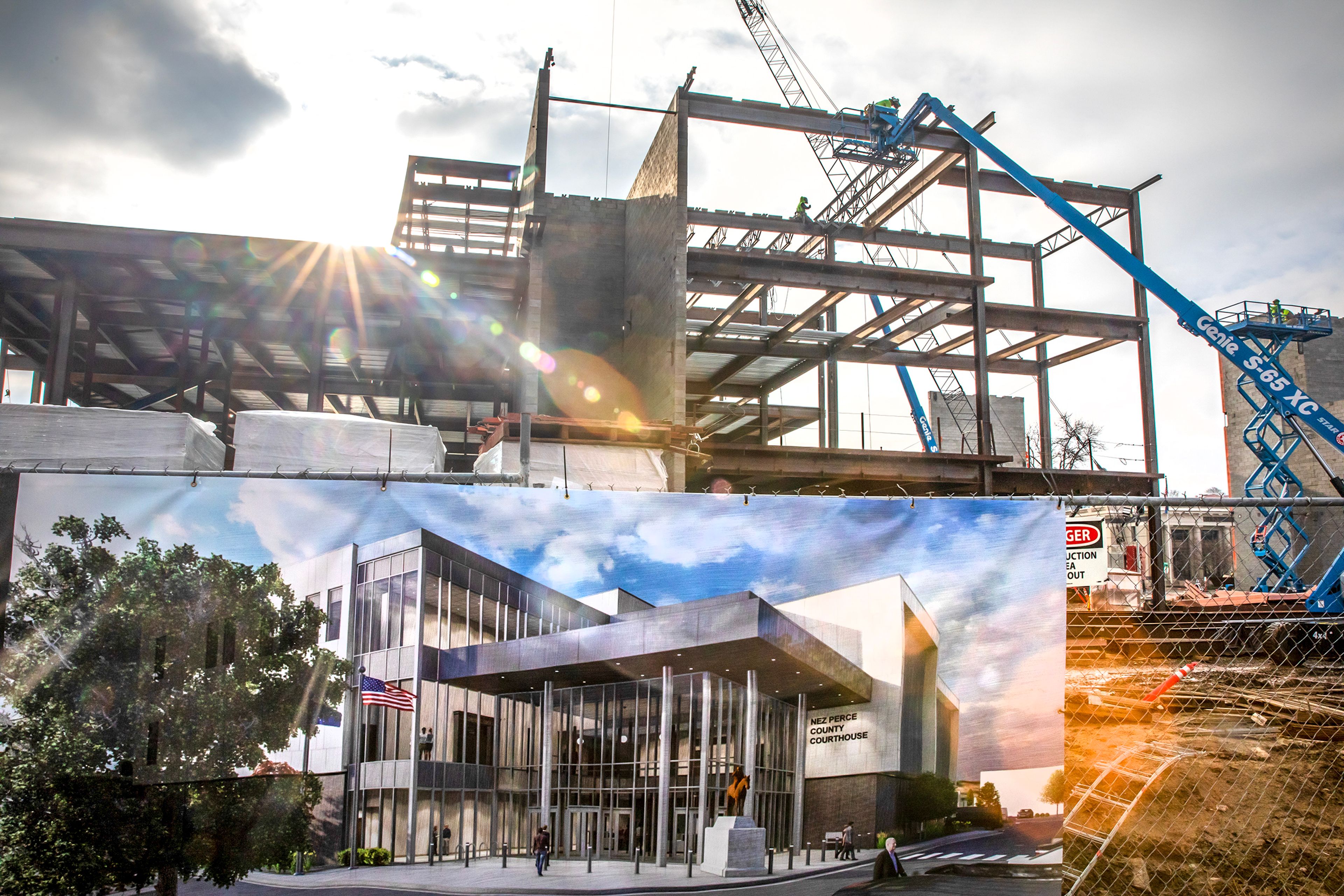 A rendering of the new courthouse sits on the fence as construction continues Thursday, Jan. 4 in Lewiston.