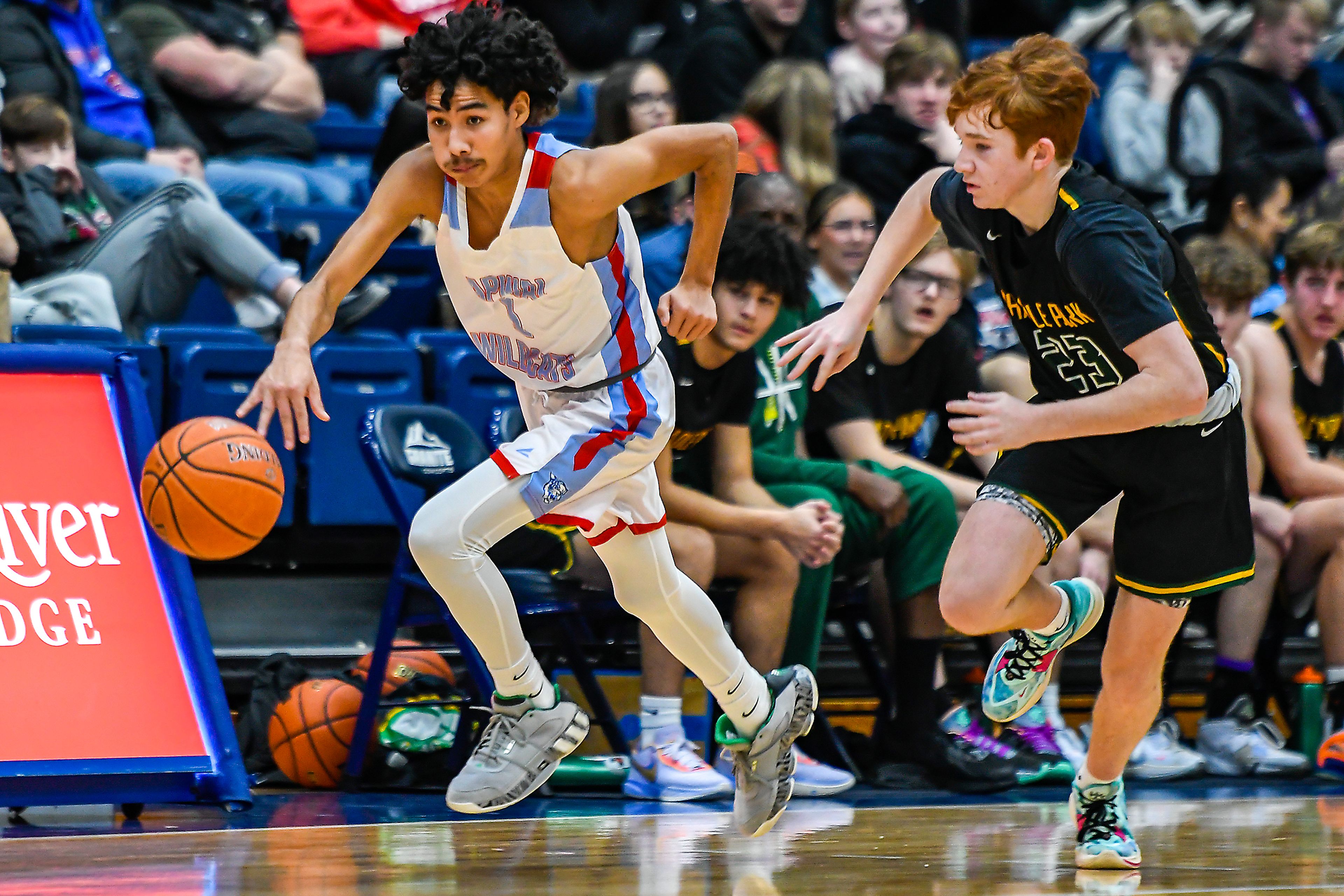 Lapwai guard Terrell Ellenwood-Jones, left, dribbles away from Shadle Park guard Quinn Moses during Thursday's Avista Holiday Tournament boys basketball final at the P1FCU Activity Center in Lewiston.