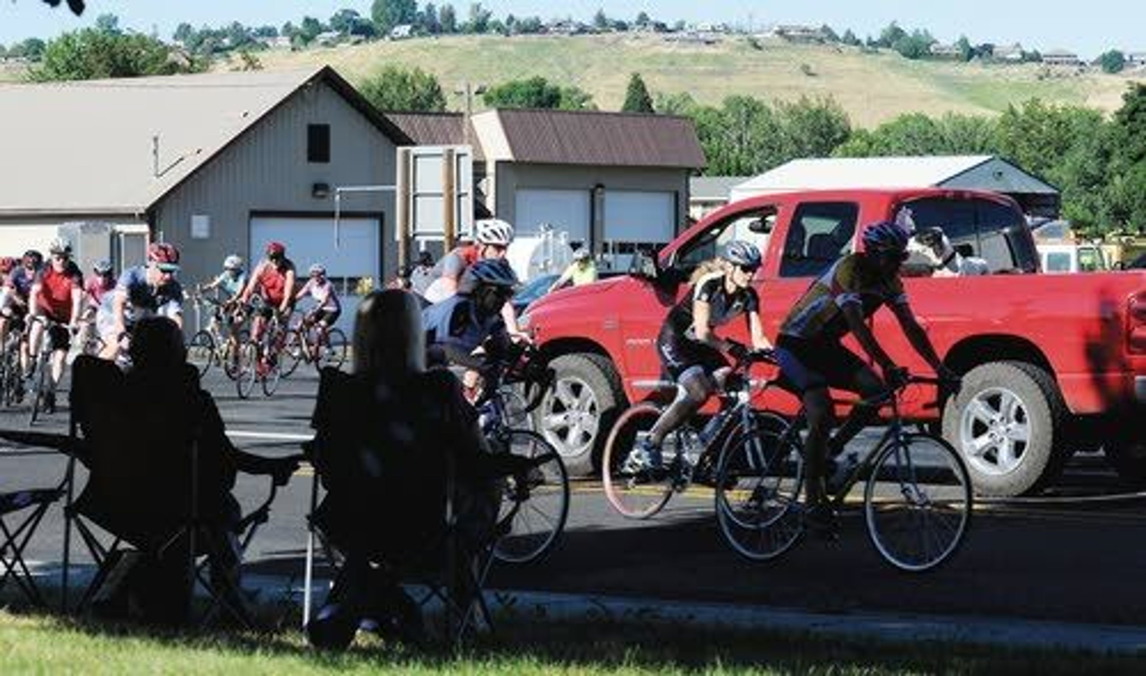 Cyclists negotiate traffic as they turn off of Highway 12 on the west side of Clarkston, heading for Red Wolf Crossing Bridge.