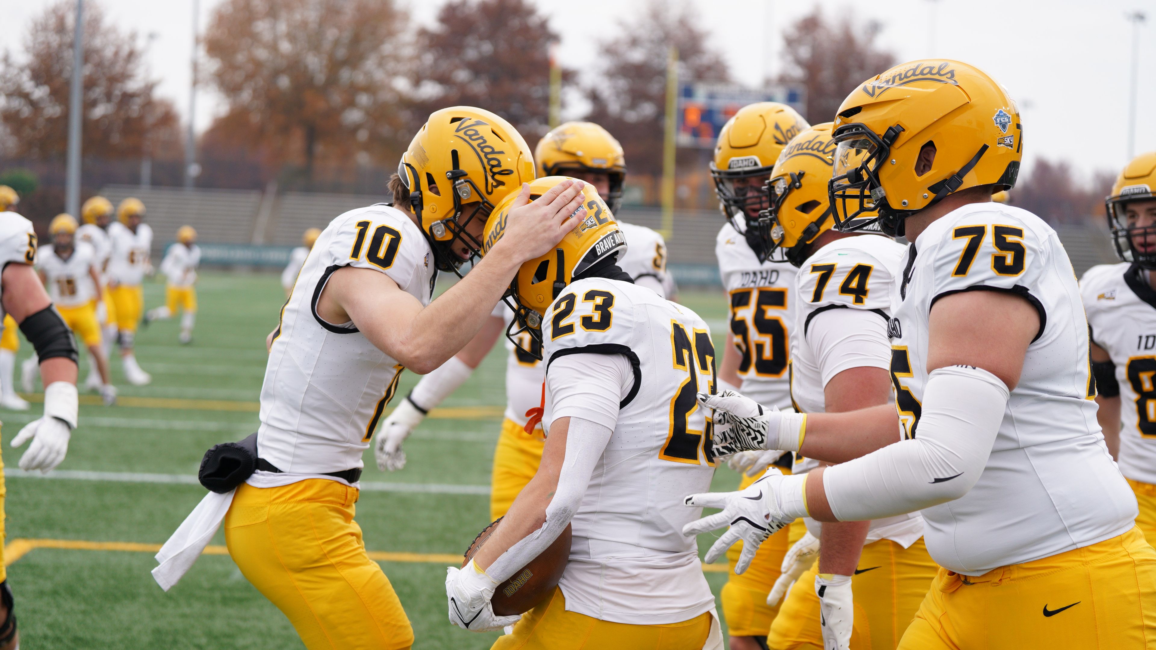 Idaho running back Art Williams (23) is congratulated by quarterback Jack Wagner (10) and offensive lineman Ayden Knapik during a game against Portland State on Saturday in Hillsboro, Ore.