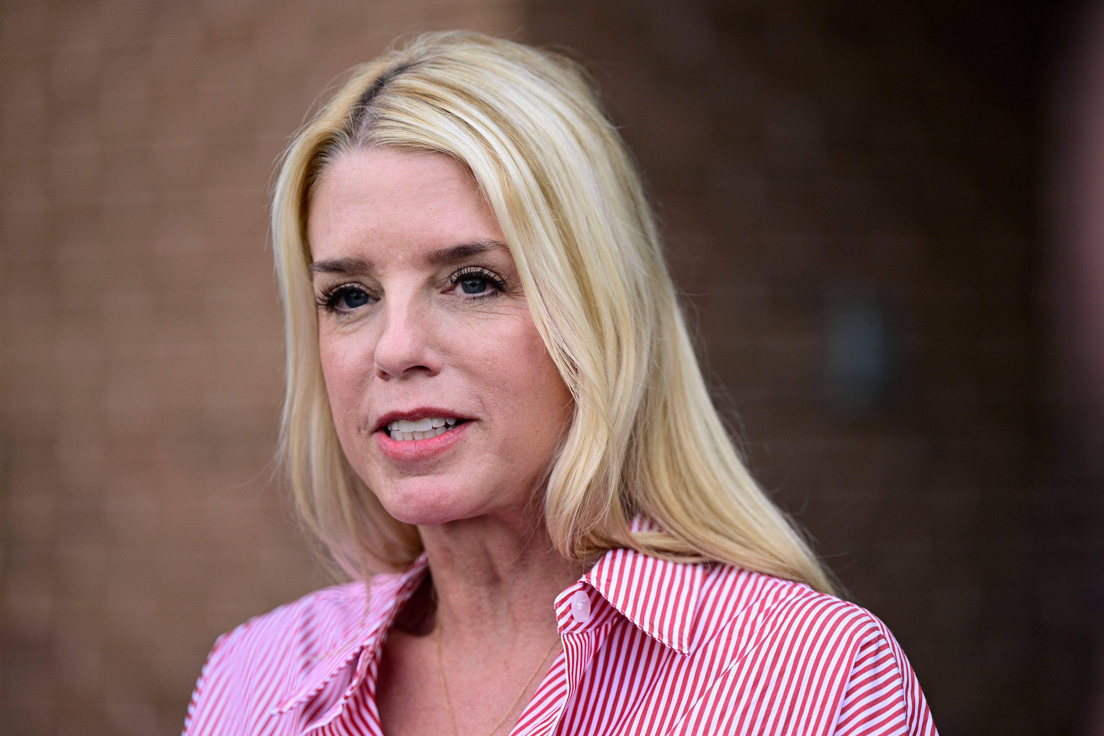 FILE - Pam Bondi, former Florida Attorney General, speaks to reporters outside an election integrity volunteer training, June 18, 2024, in Newtown, Pa. (AP Photo/Derik Hamilton, File)