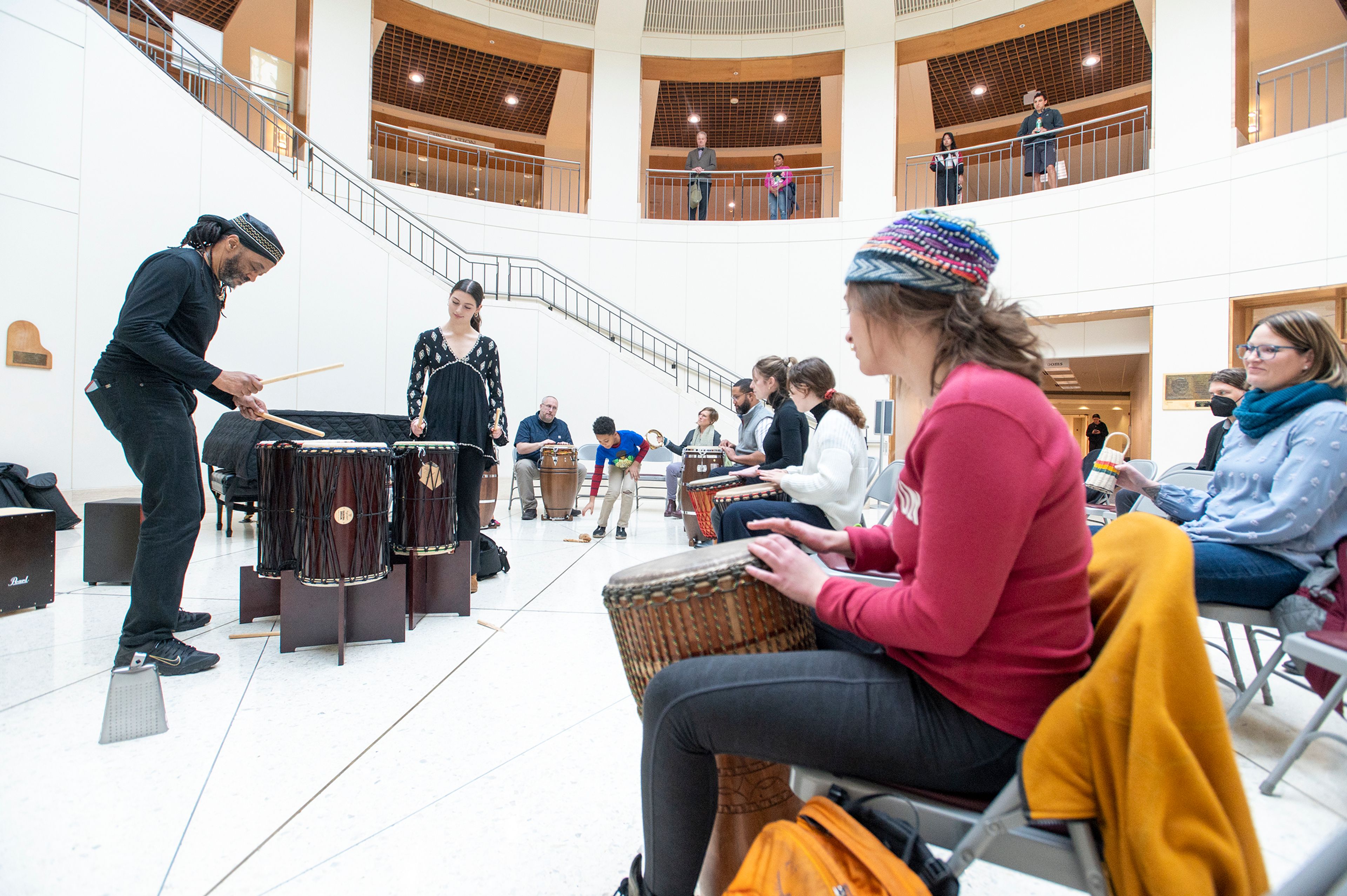 Dr. Darryl Singleton, left, leads a drum circle Tuesday at Washington State University’s Terrell Library Atrium in Pullman for the National Day of Racial Healing. “When people who’ve never been together, decide to be together, things can get together,” Singleton said. Singleton is an Assistant Professor of Black Music in America and Social Justice at WSU.