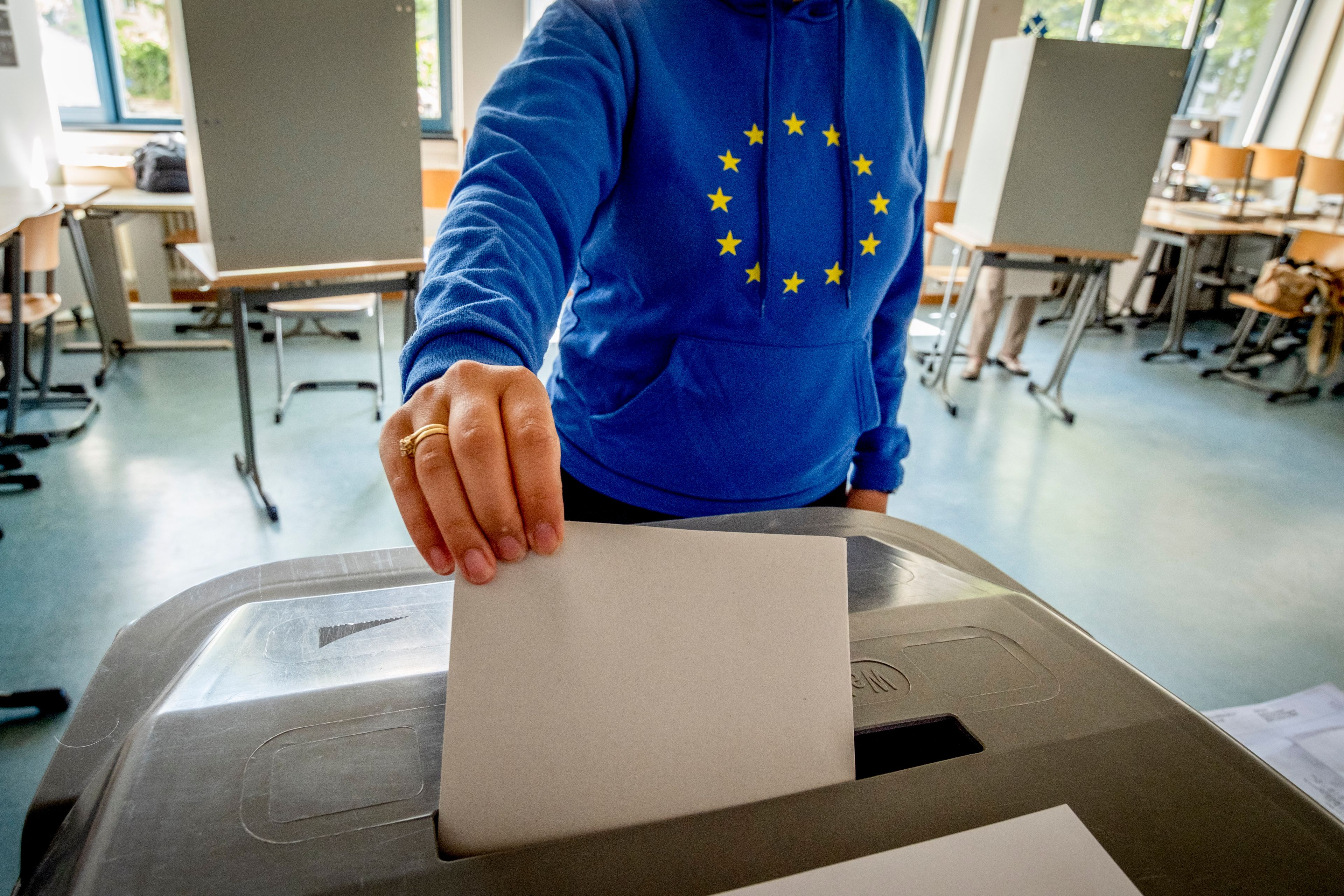 A woman casts her ballot for the European elections in a polling station in Frankfurt, Germany, Sunday, June 9, 2024.