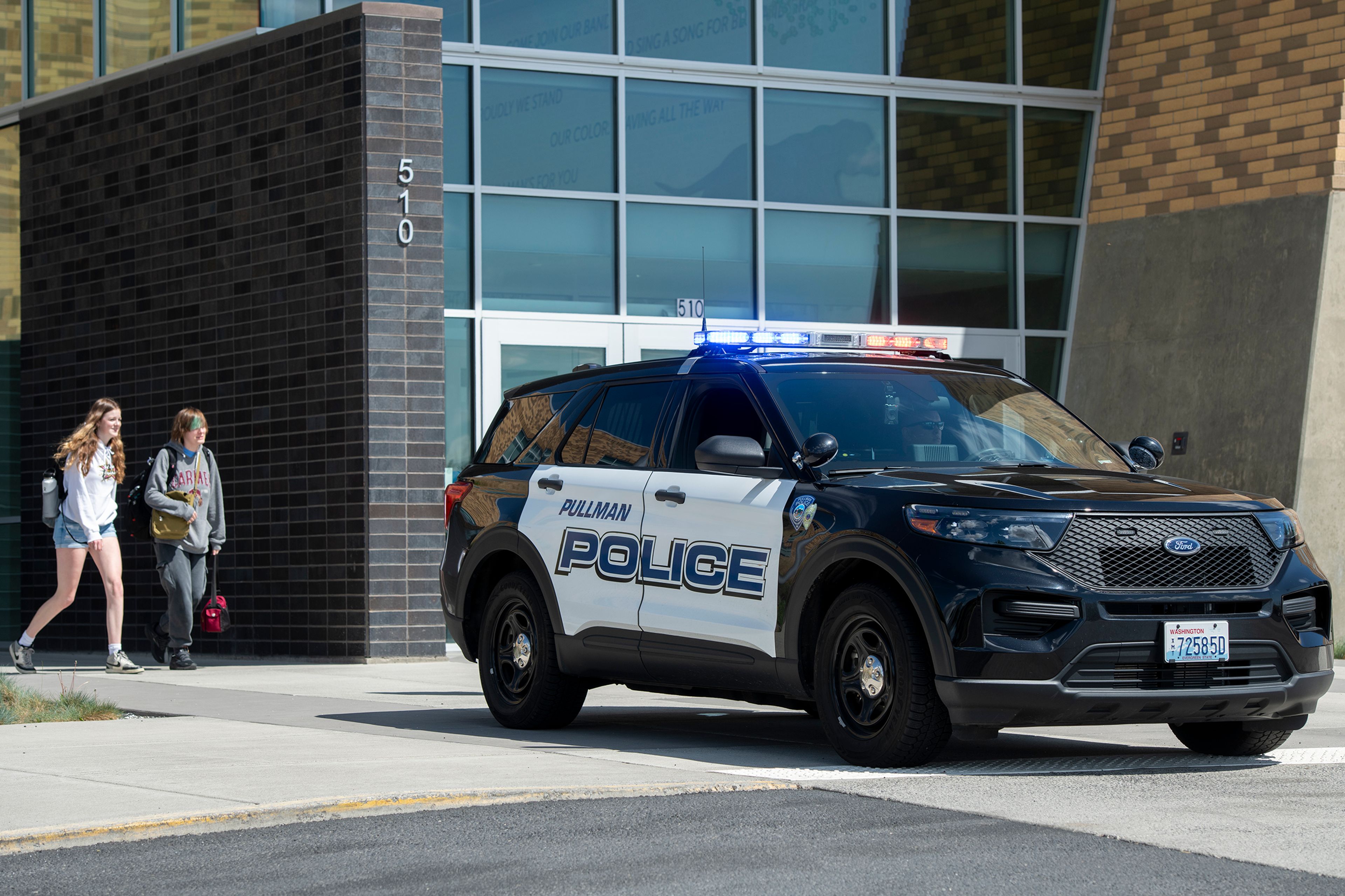 FILE: A Pullman police officer parks outside of Pullman High School on April 10, 2023.