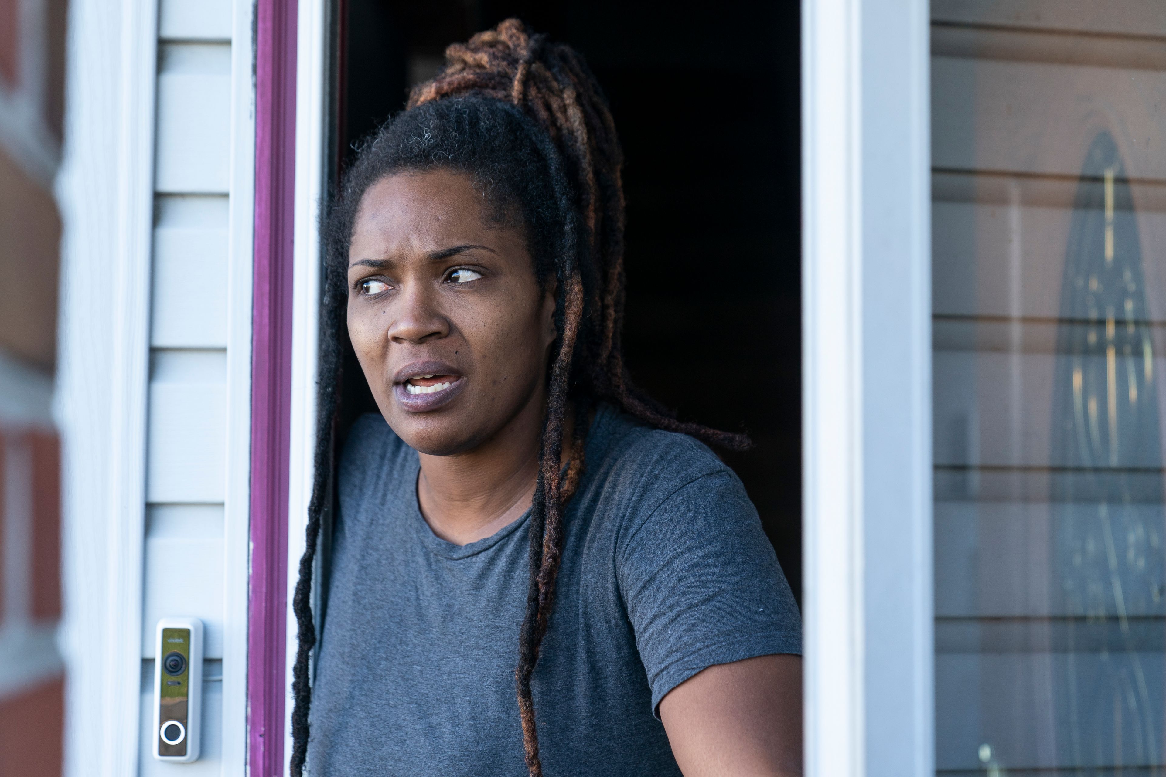 Alicia McDuffie speaks with The Associated Press after police served a search warrant at the home of her neighbor, the suspected shooter of a mass shooting at a Walmart, Wednesday, Nov. 23, 2022, in Chesapeake, Va. Police say a shooter opened fire in the store, leaving six people dead. It was the countryâ€™s second high-profile mass killing in a handful of days. (AP Photo/Alex Brandon)