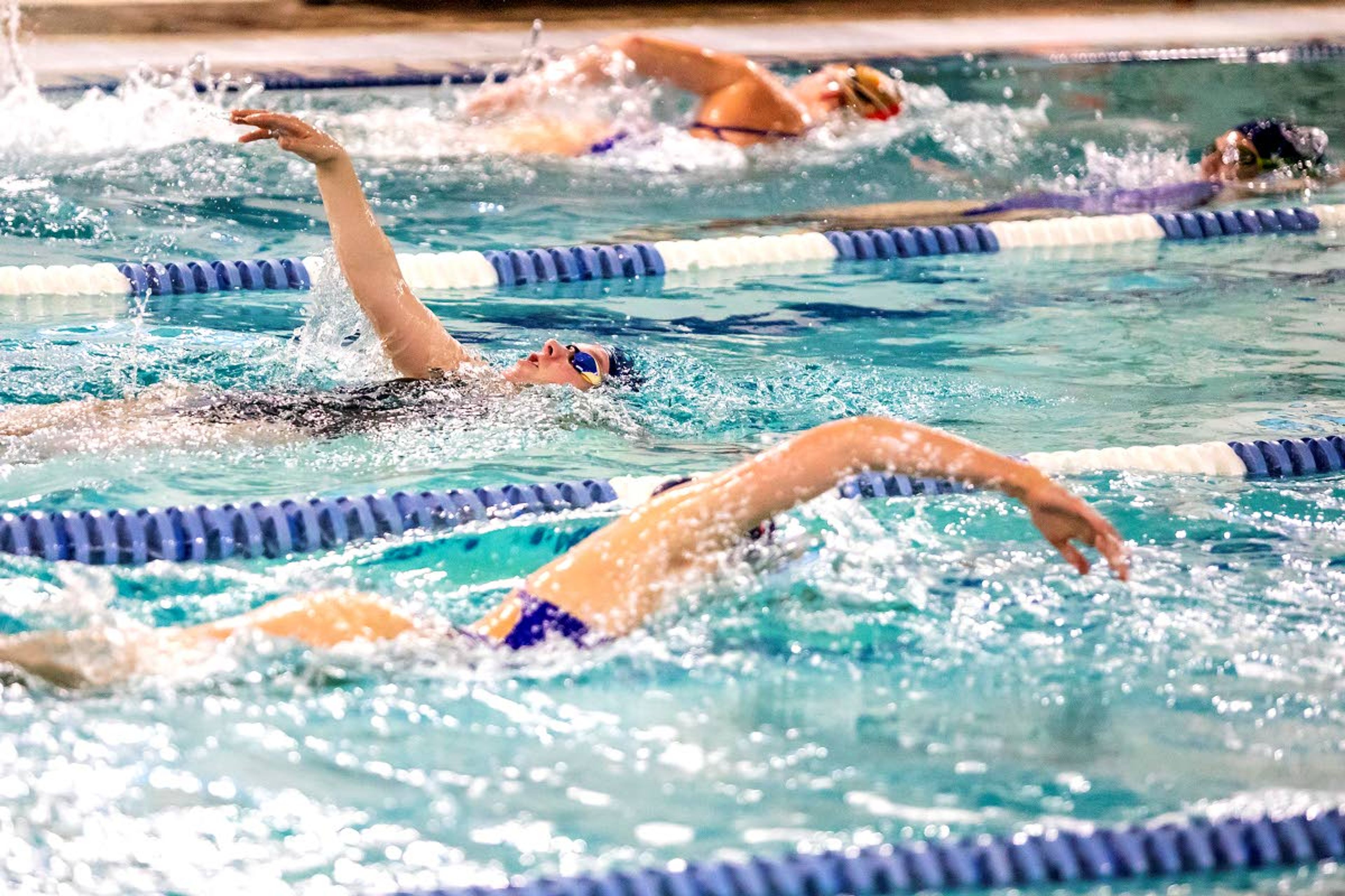 Swimmers cut through the water doing a variety of strokes during Wednesday’s practice at the Pullman Aquatic Center.