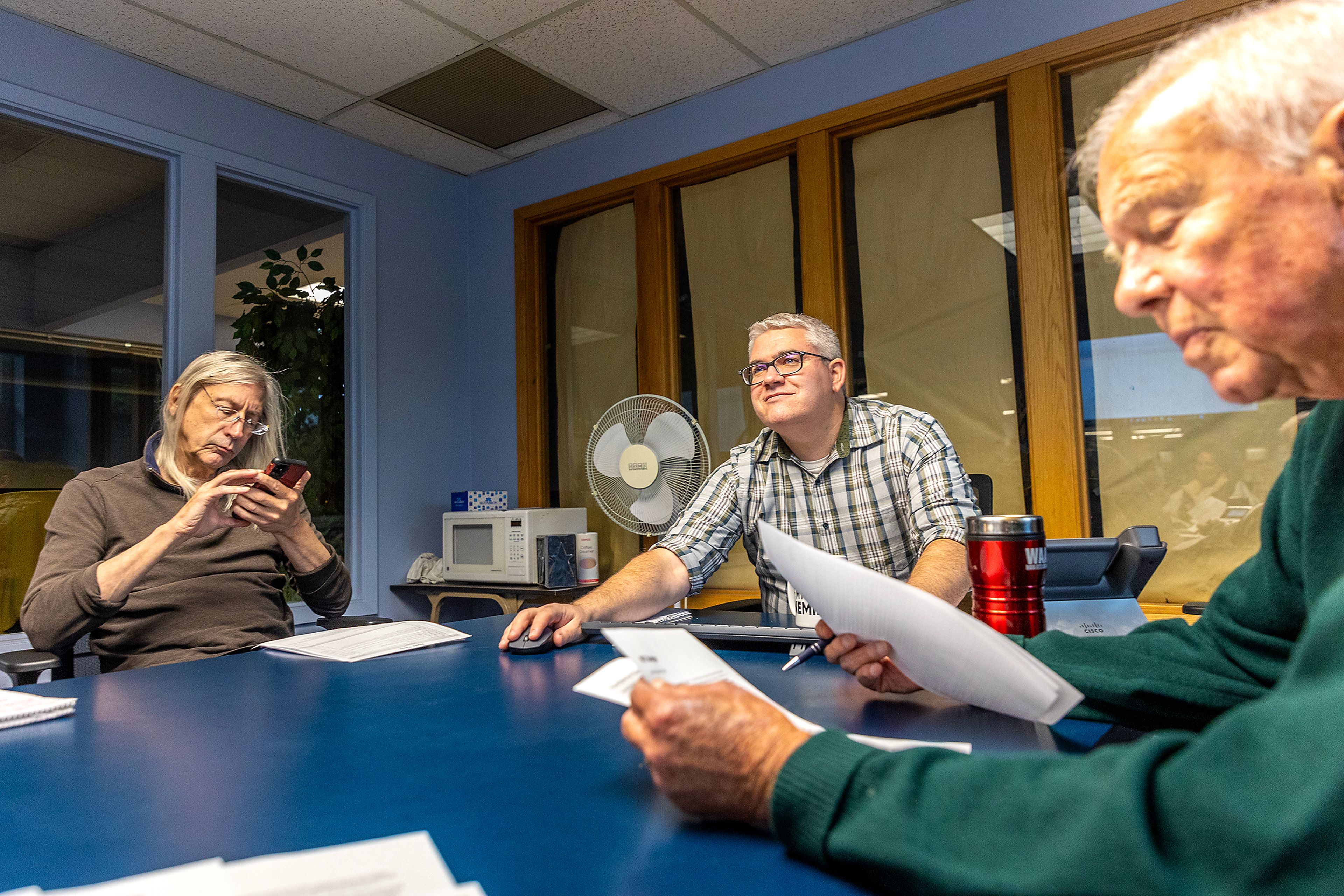 Lewiston Tribune Managing Editor Matt Baney (center) prepares for the daily news meeting  in Lewiston.