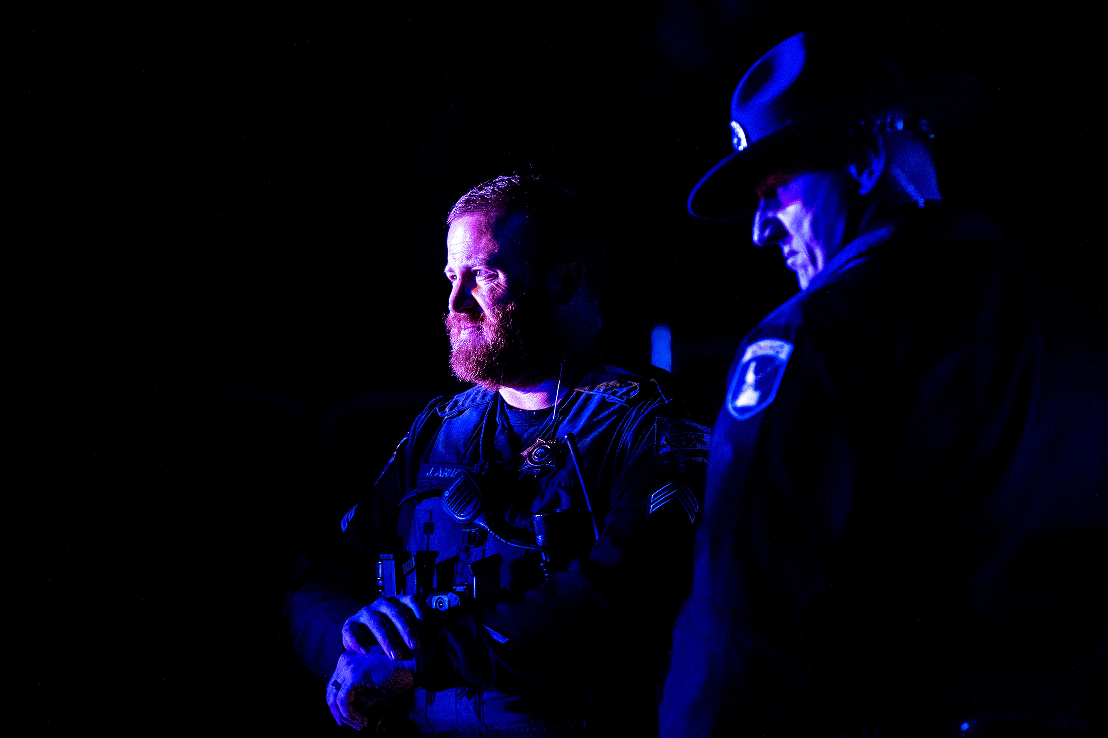 Officers from Lewiston Police Department and Idaho State Police look on at the scene of a shooting on Bryden Drive in the Lewiston Orchards on Sunday evening.