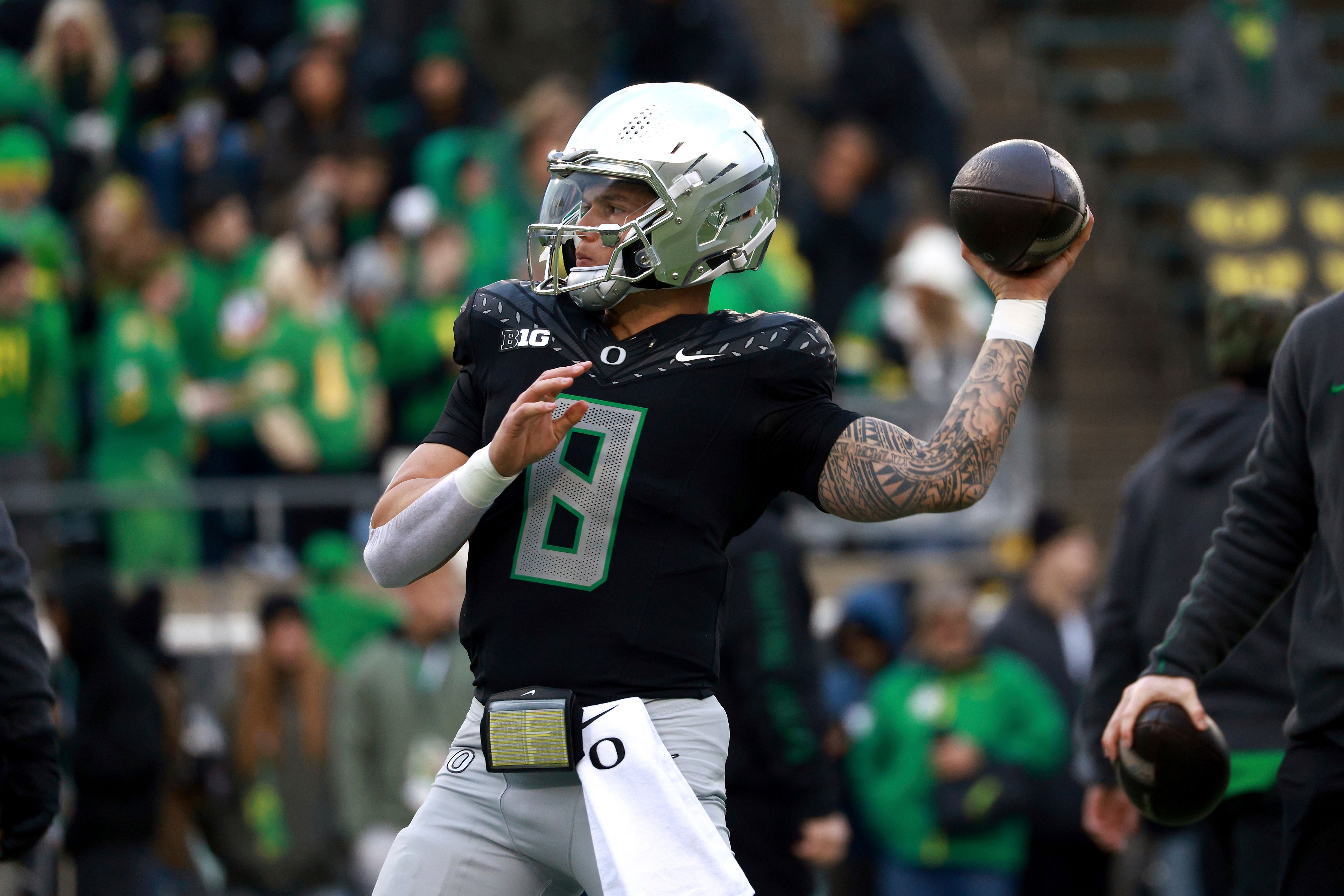 Oregon quarterback Dillon Gabriel warms up before an NCAA college football game against Washington, Saturday, Nov. 30, 2024, in Eugene, Ore. (AP Photo/Lydia Ely)