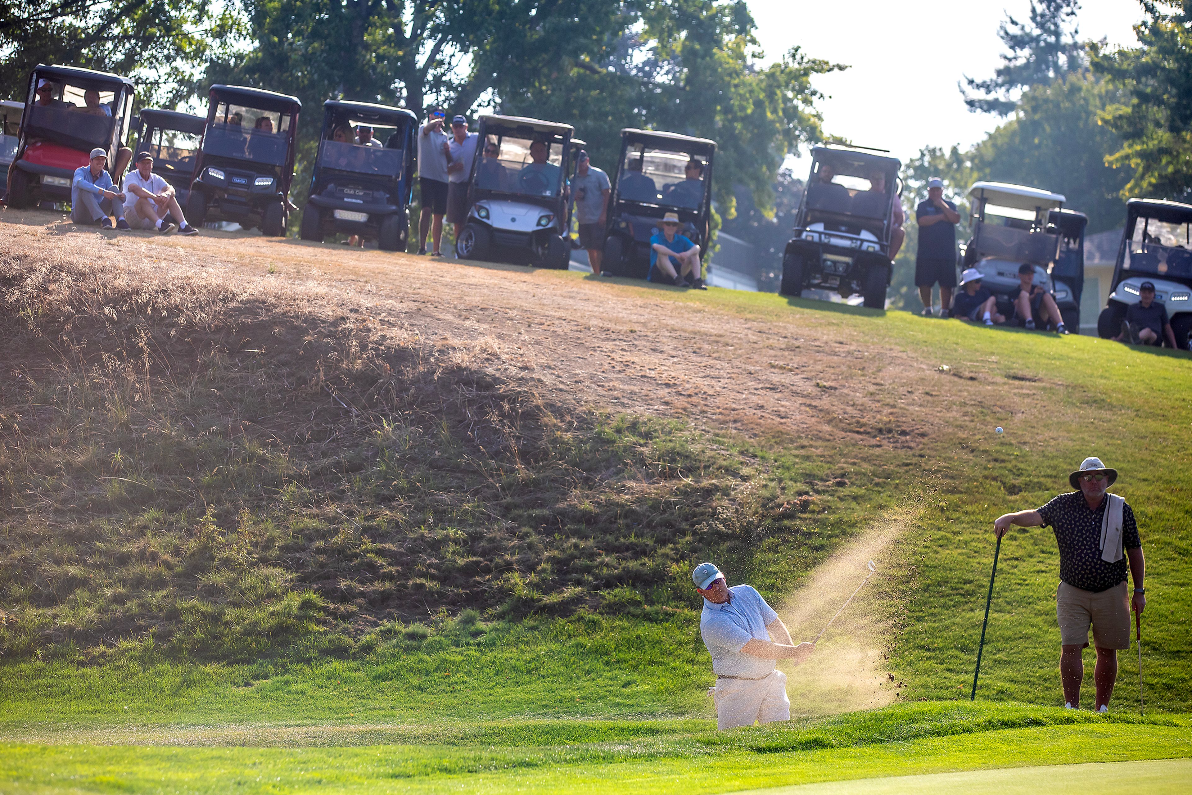 Jason Huff hits out of a sand trap at the Sole Survivor Tournament Monday at the Lewiston Golf and Country Club.