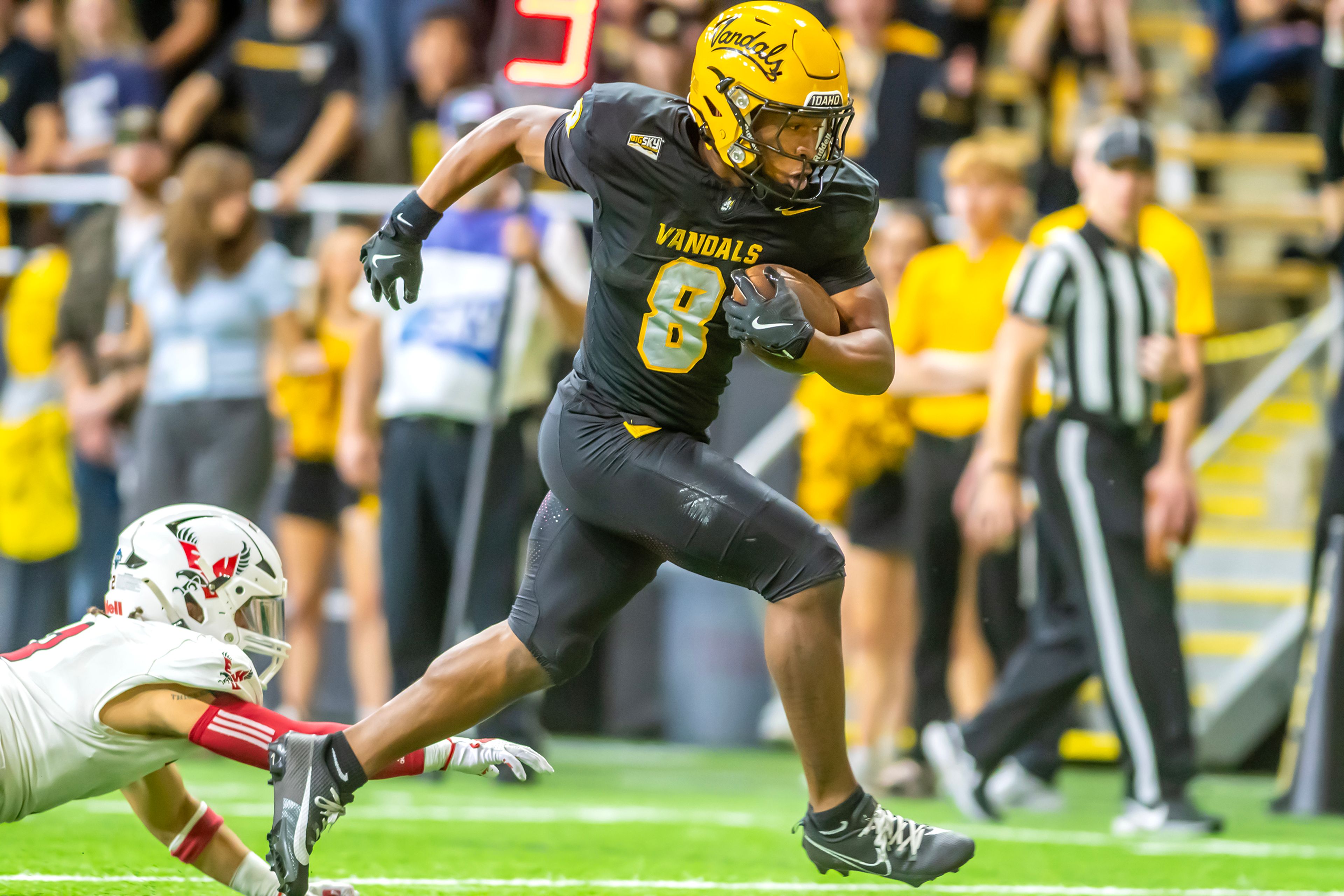 Idaho running back Deshaun Buchanan runs the ball in for a touchdown against Eastern Washington during a Big Sky game Saturday at the Kibbie Dome in Moscow. ,