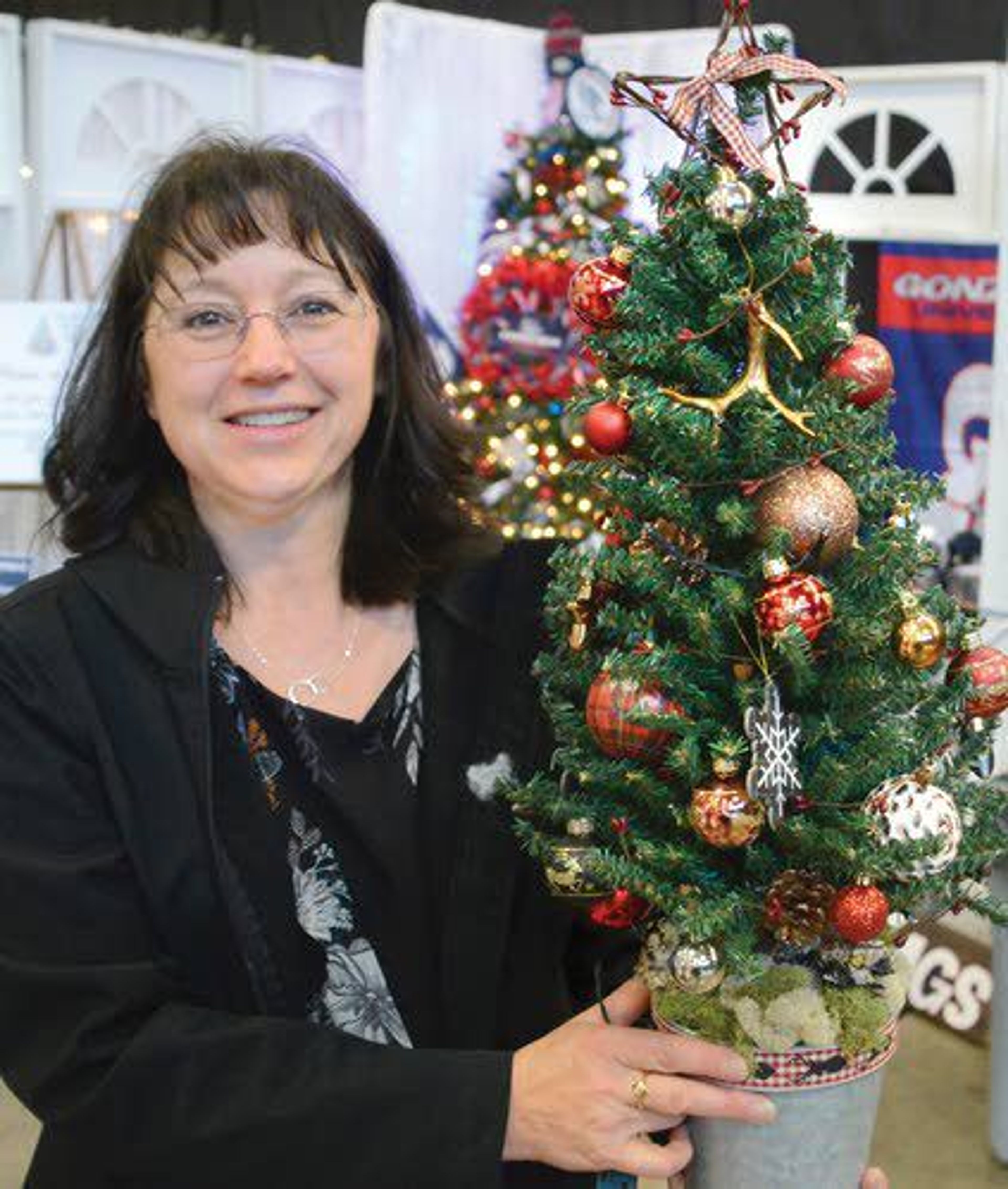 Kathy Smolinski of Lewiston bought a miniature tree to brighten her office.